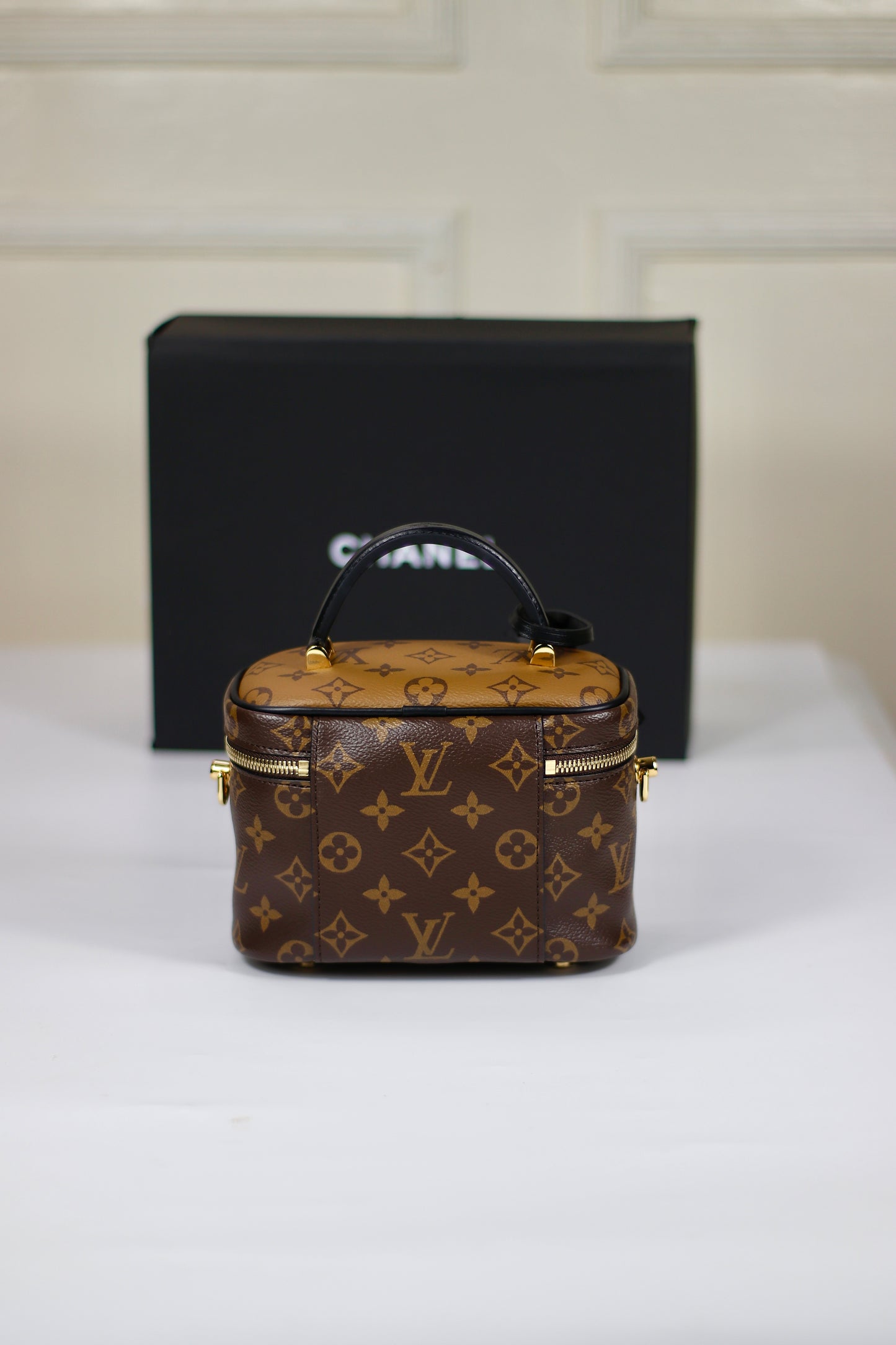 Vanity PM – Monogram Canvas with Black Leather Trim