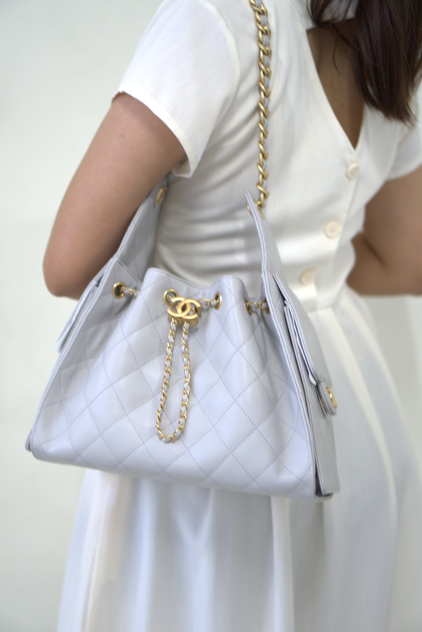 25C Small Drawstring Bag – Light Gray Caviar with Gold Hardware