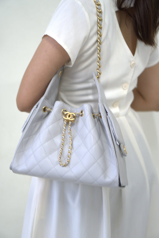 25C Small Drawstring Bag – Light Gray Caviar with Gold Hardware