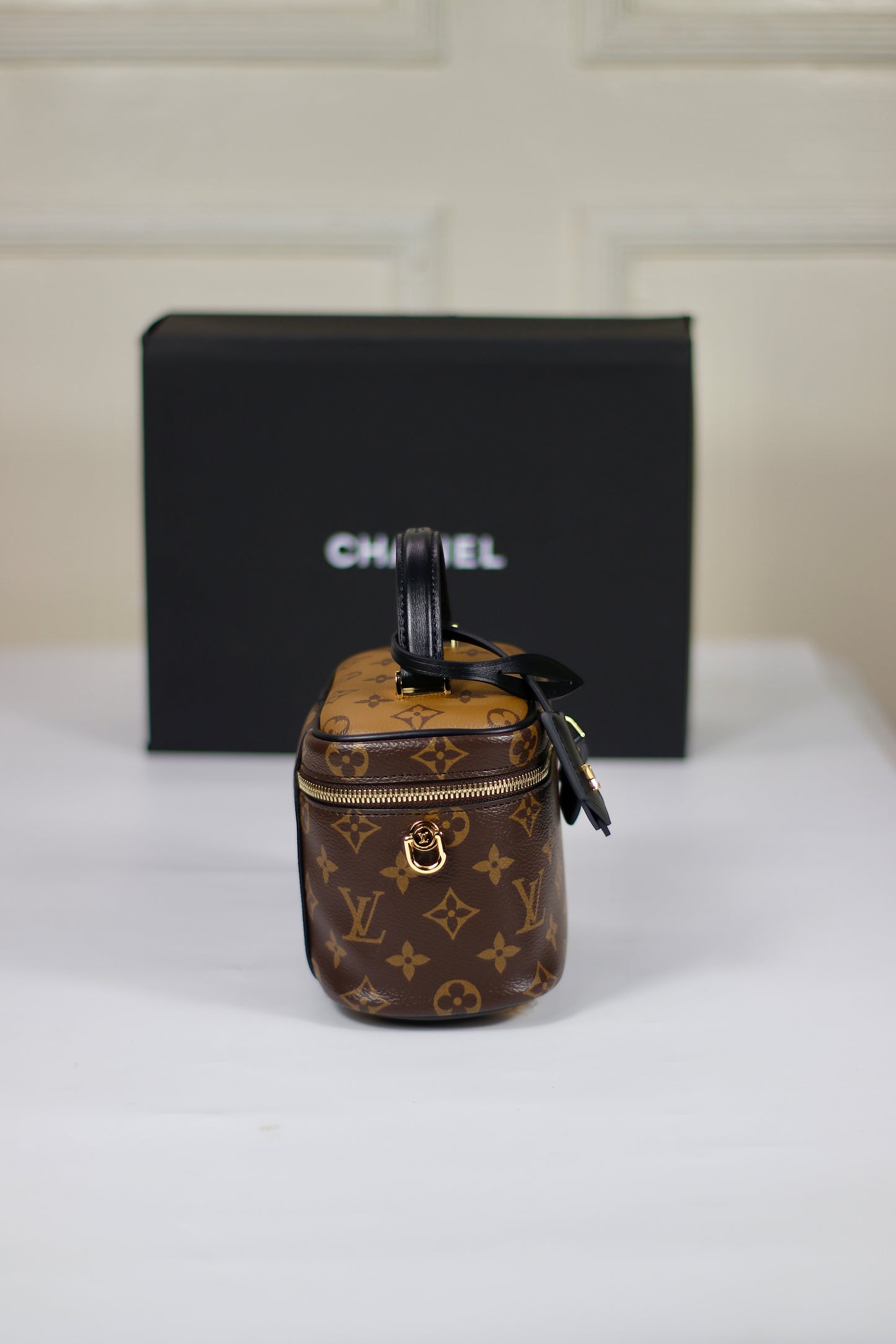 Vanity PM – Monogram Canvas with Black Leather Trim