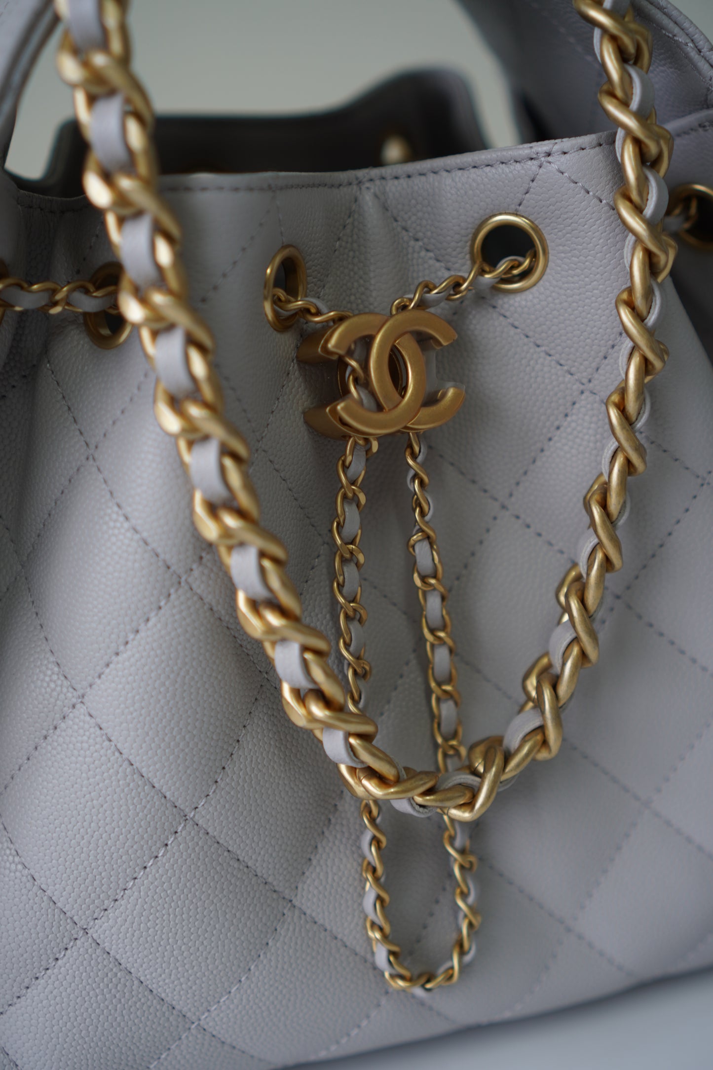25C Small Drawstring Bag – Light Gray Caviar with Gold Hardware