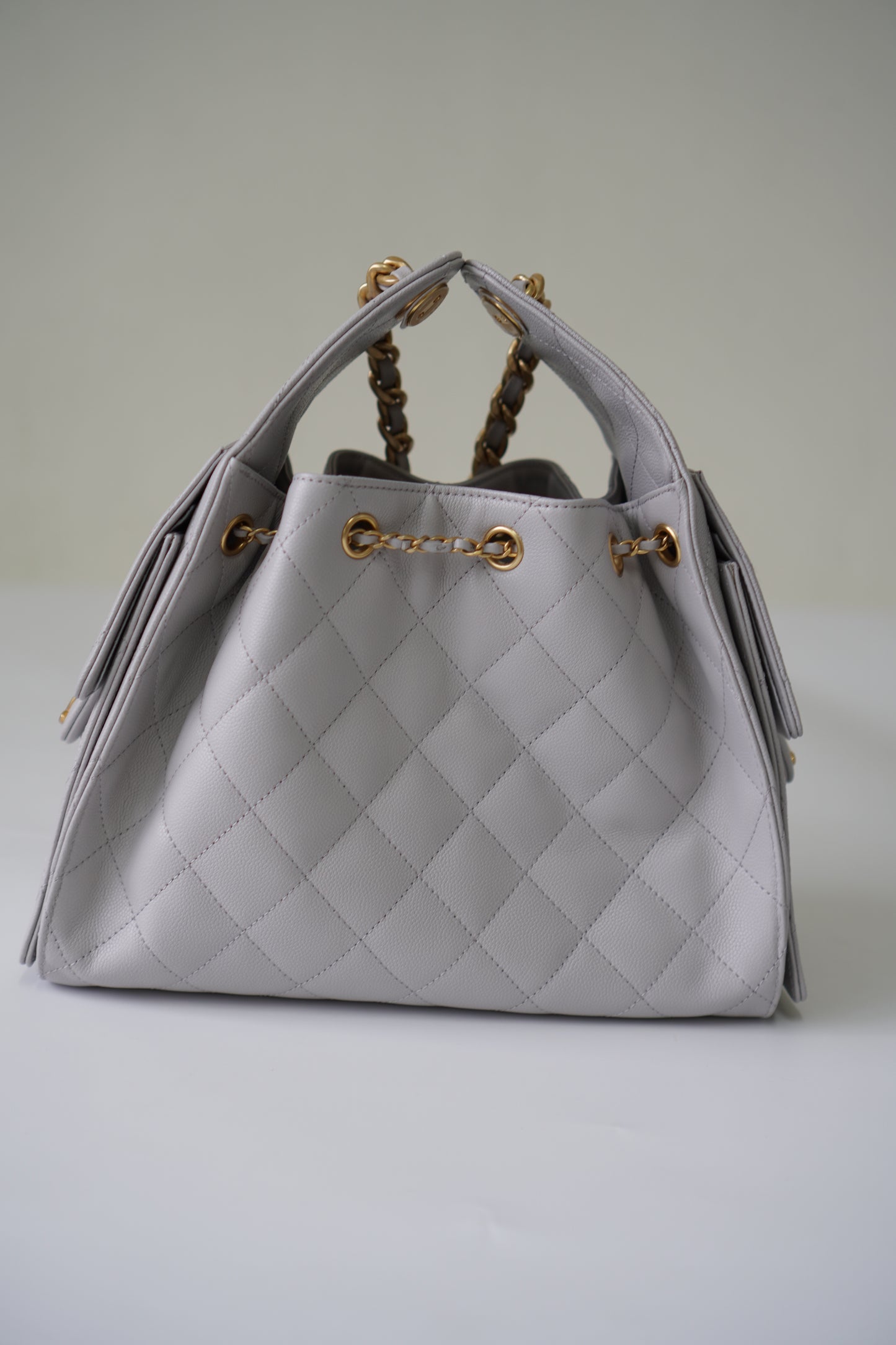 25C Small Drawstring Bag – Light Gray Caviar with Gold Hardware