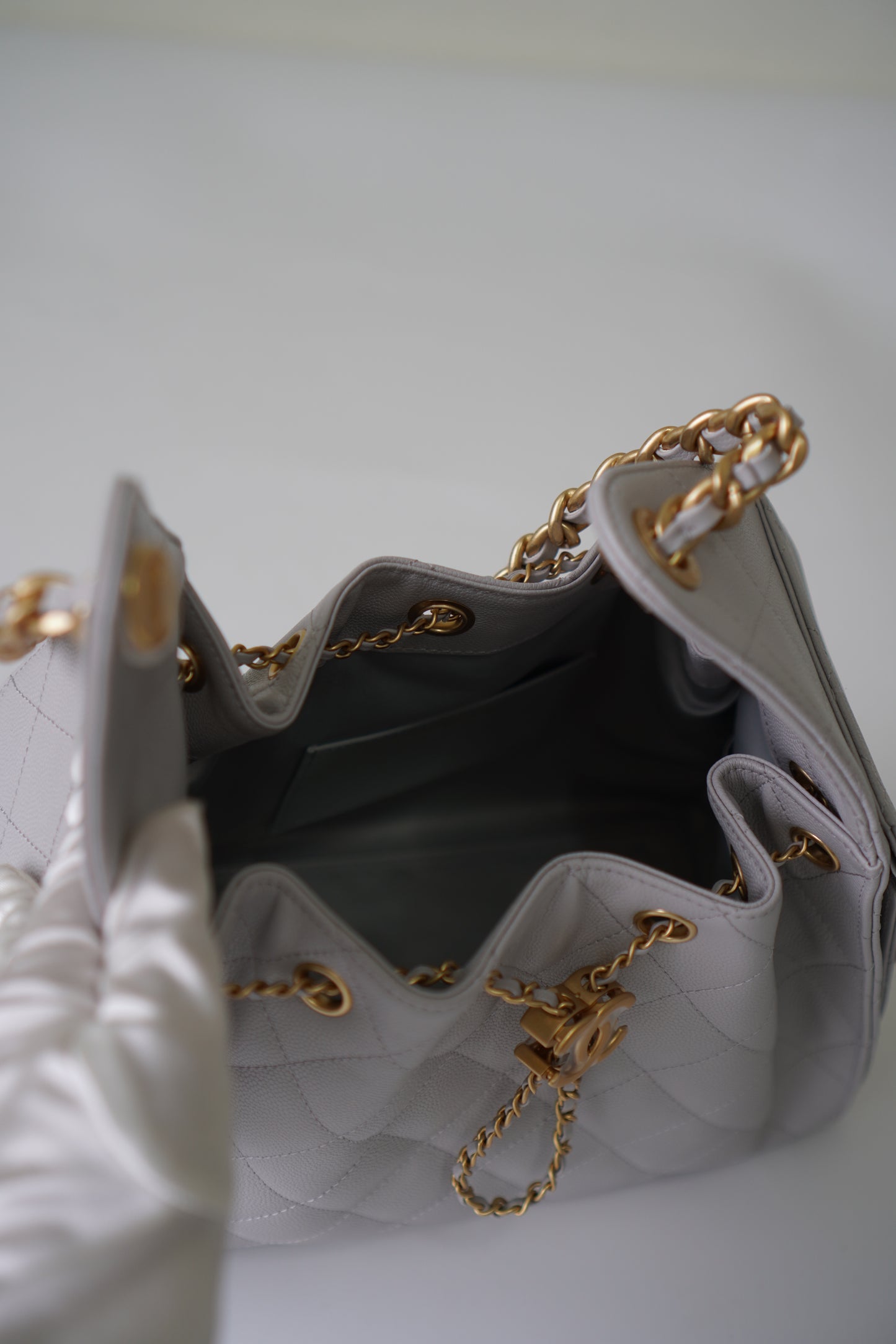 25C Small Drawstring Bag – Light Gray Caviar with Gold Hardware