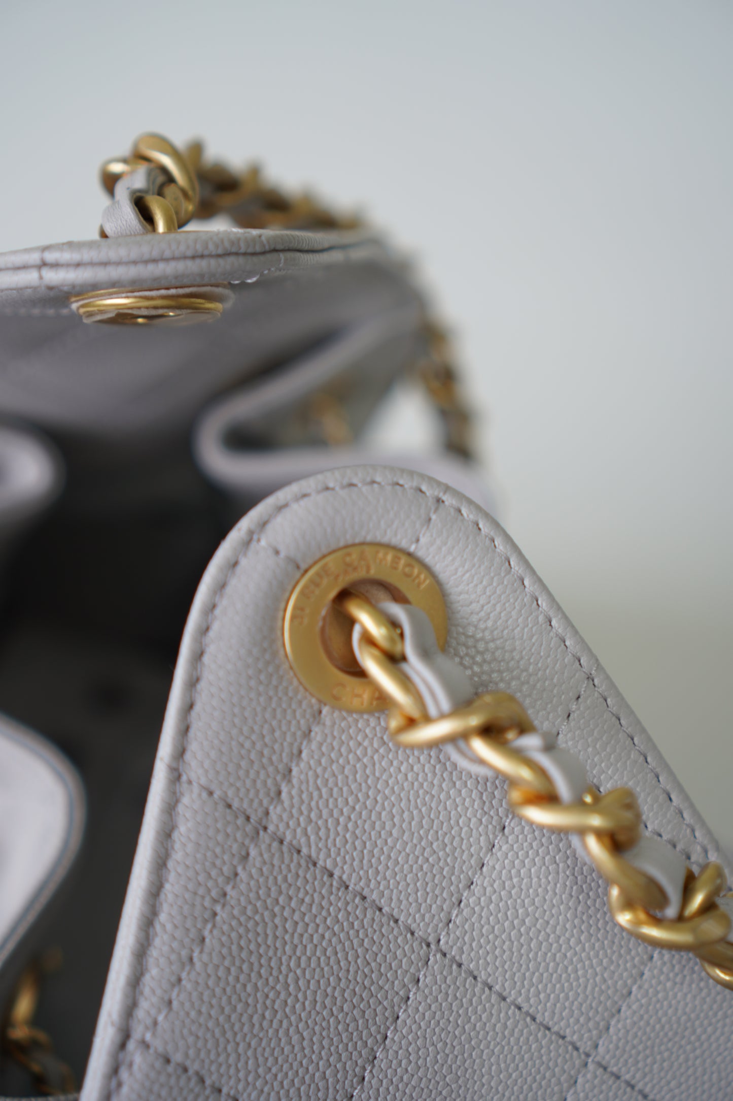 25C Small Drawstring Bag – Light Gray Caviar with Gold Hardware
