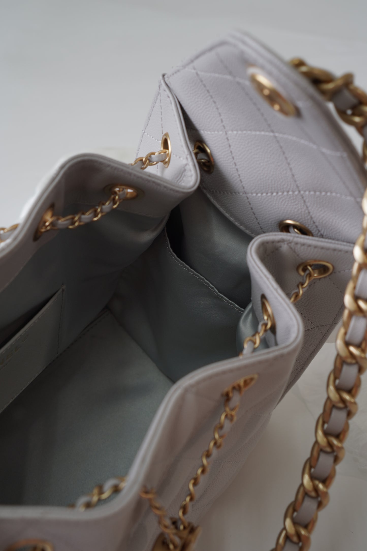 25C Small Drawstring Bag – Light Gray Caviar with Gold Hardware