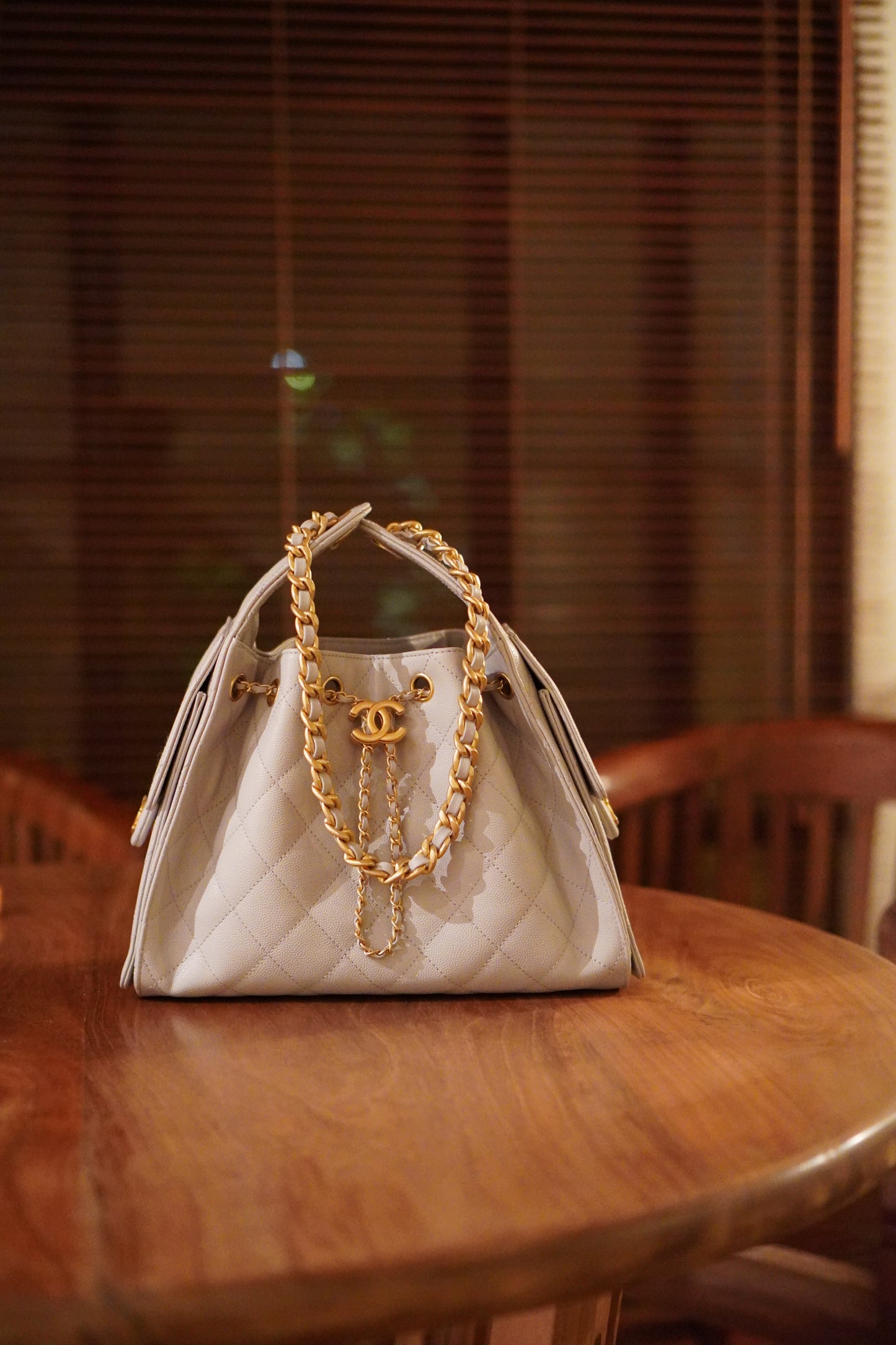 25C Small Drawstring Bag – Light Gray Caviar with Gold Hardware