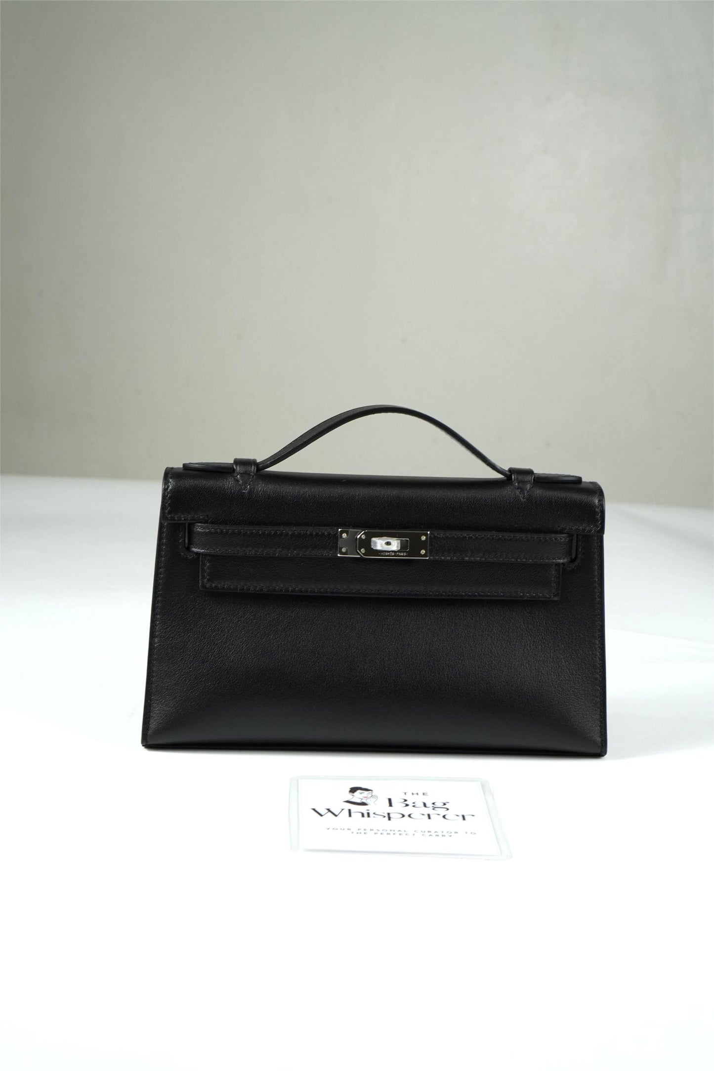 Kelly Pochette in Noir Swift leather