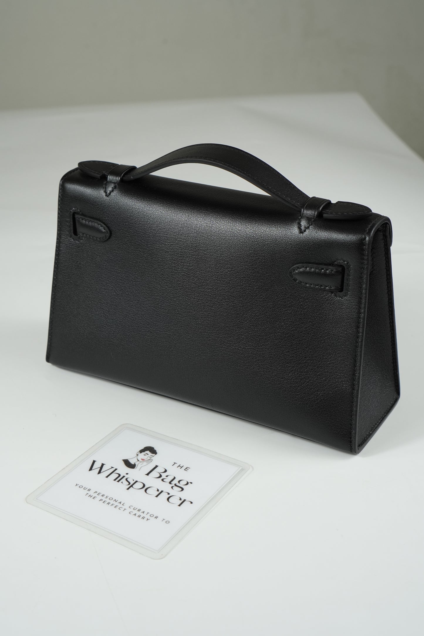 Kelly Pochette in Noir Swift leather