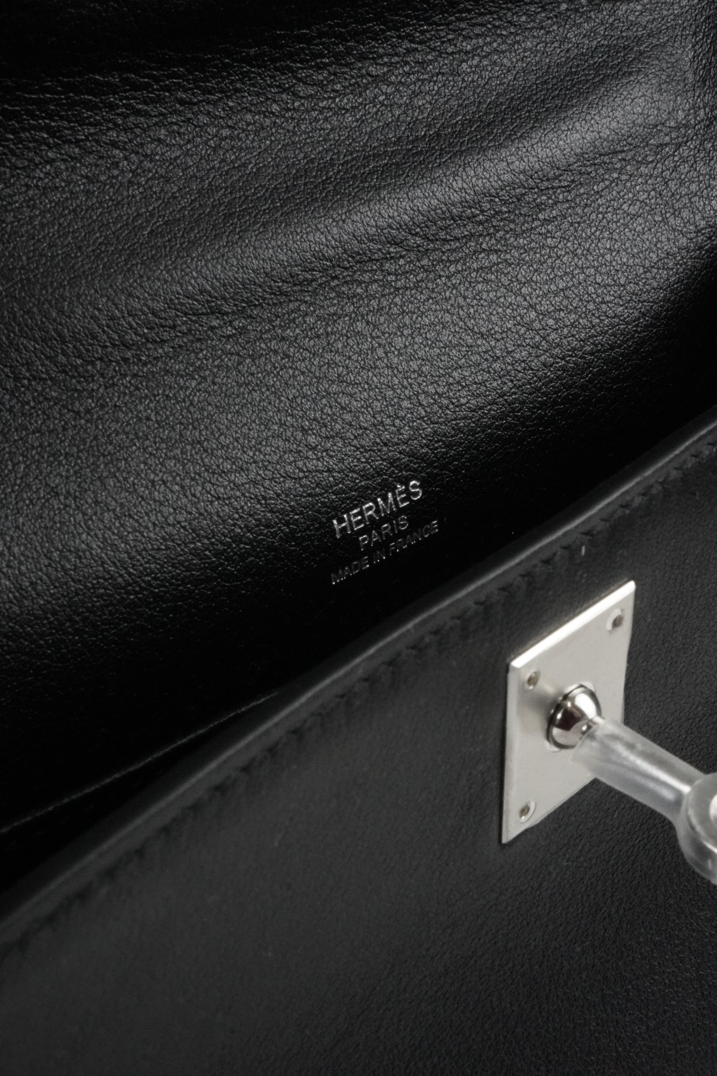 Kelly Pochette in Noir Swift leather