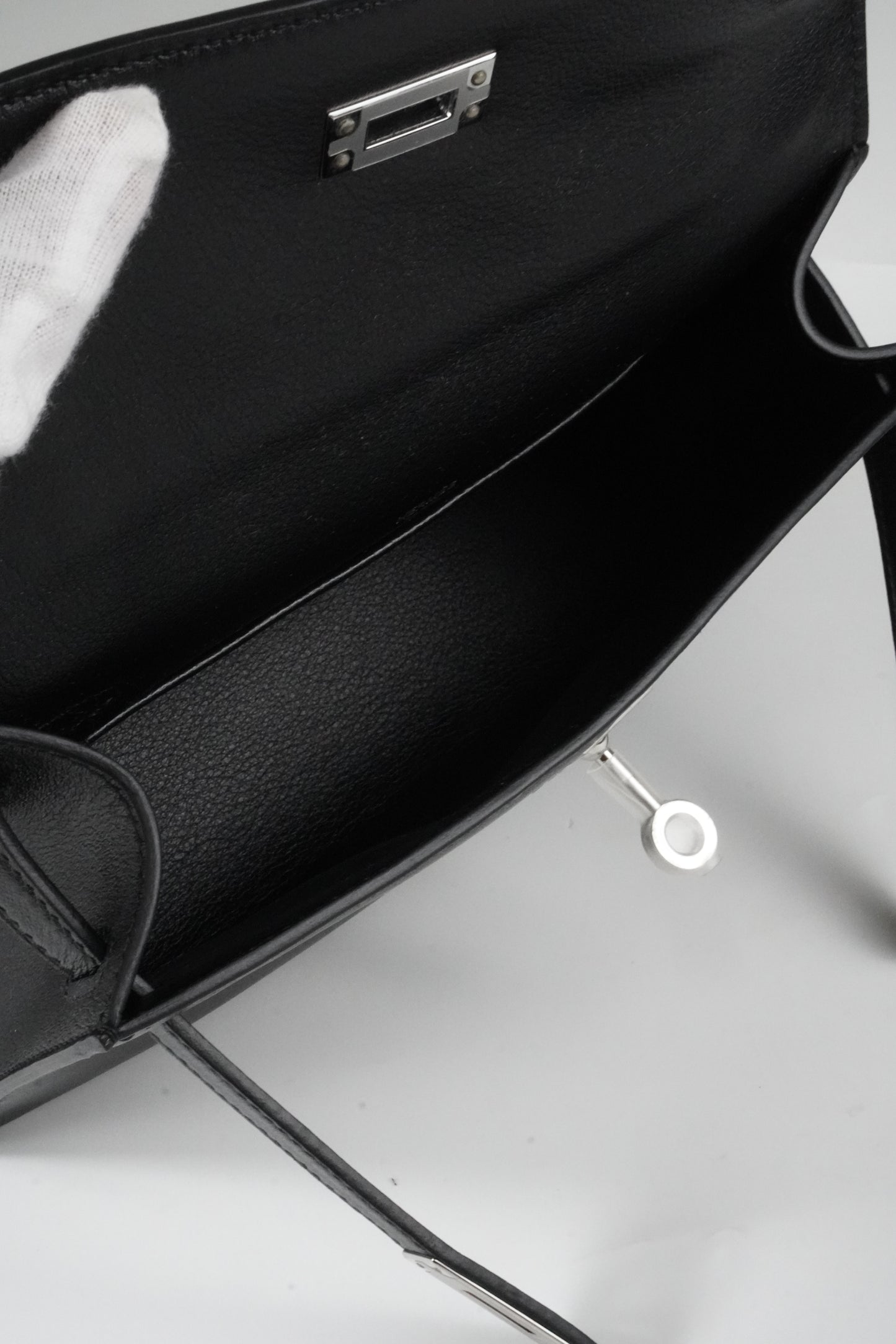 Kelly Pochette in Noir Swift leather
