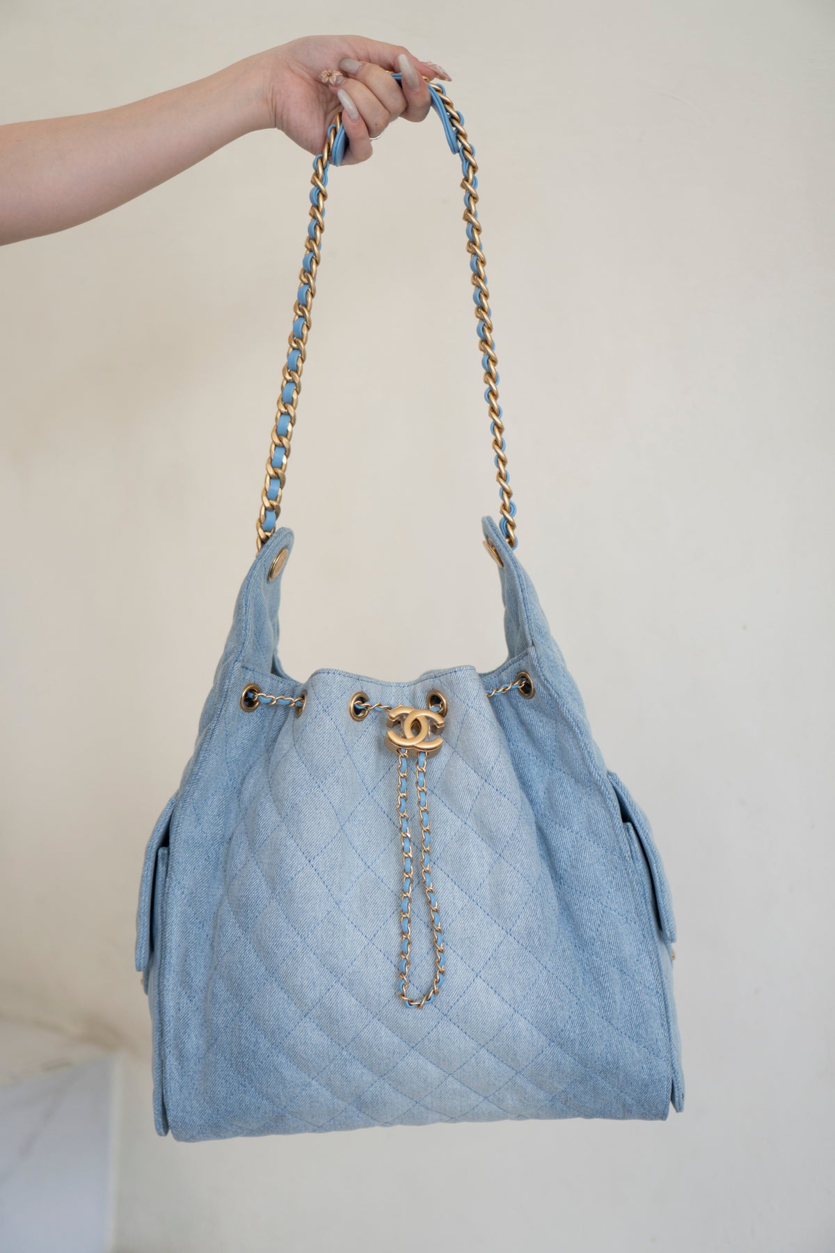 C25 Medium Drawstring Chain Bag – Washed Denim with Gold Hardware