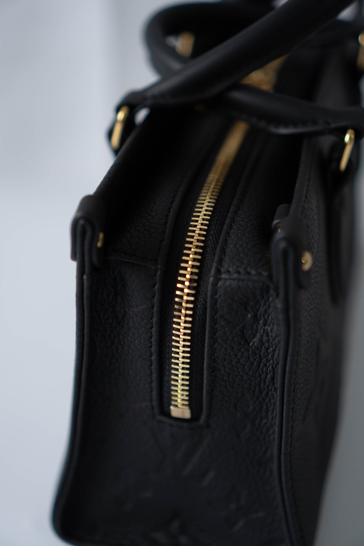 On-The-Go East West – Black Monogram Empreinte Leather with Gold Hardware