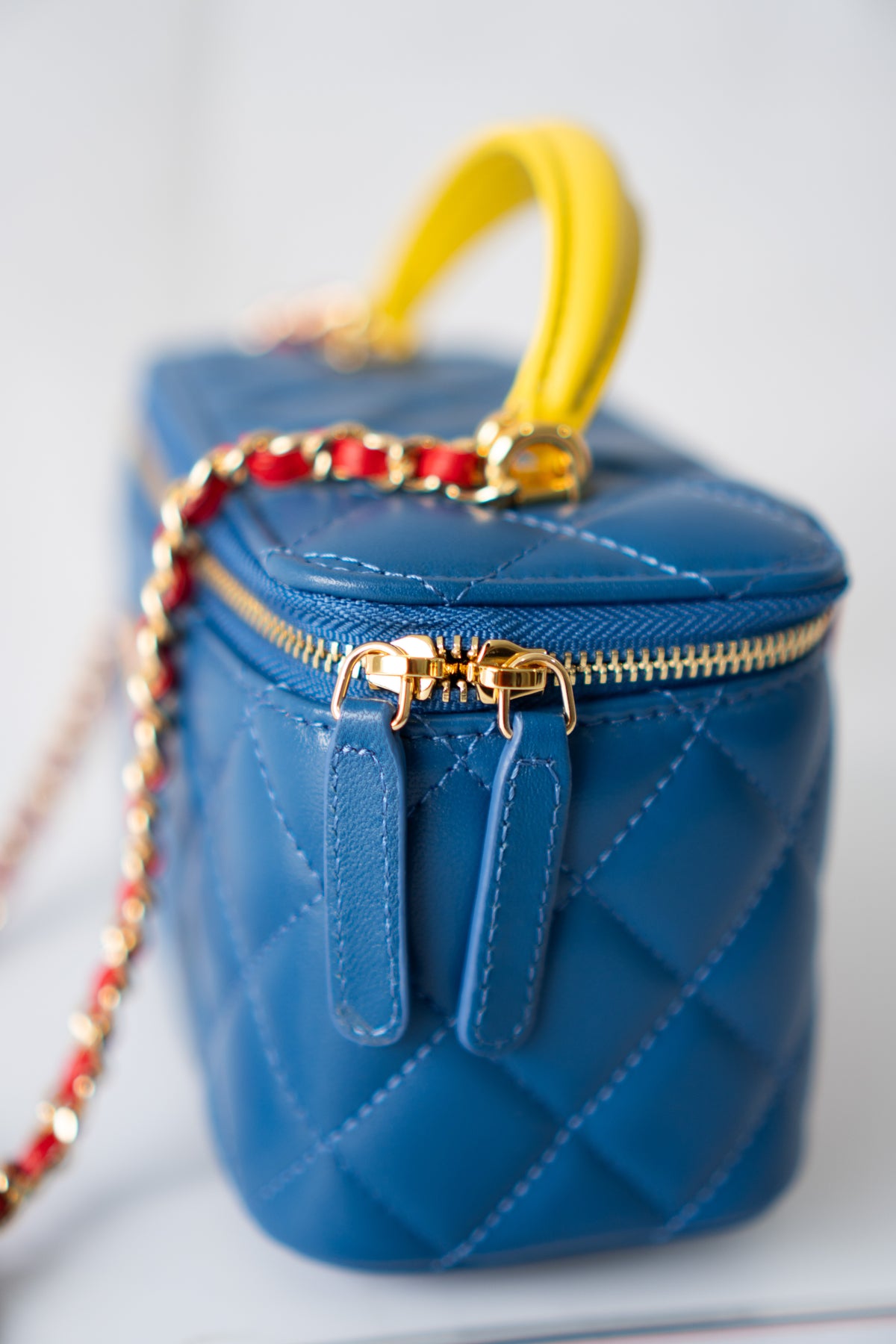 Small Vanity Case (Superman) with Top Handle – Blue Quilted Lambskin with Superhero Emblem & Gold Hardware