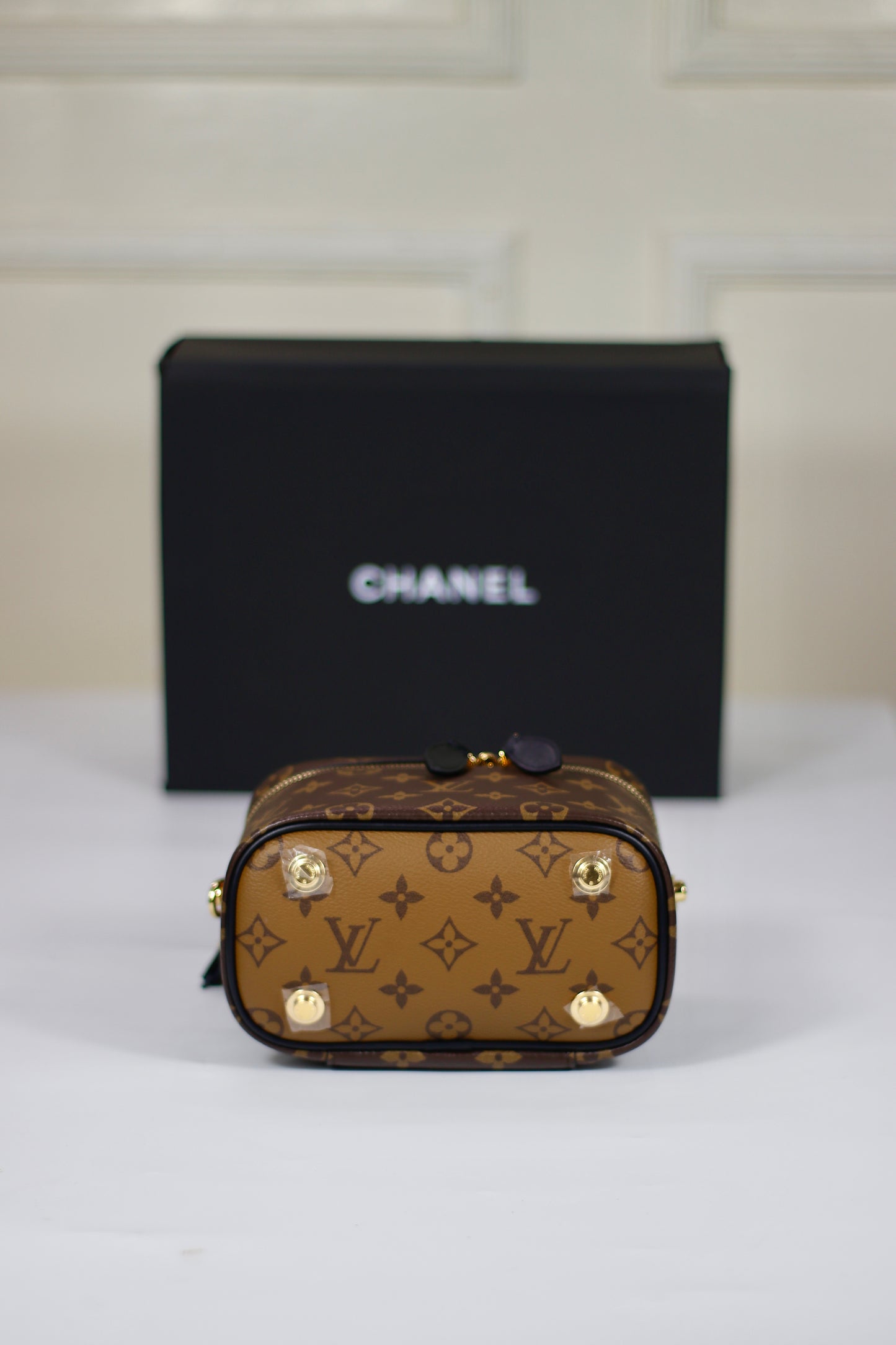 Vanity PM – Monogram Canvas with Black Leather Trim