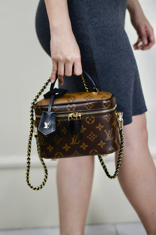 Vanity PM – Monogram Canvas with Black Leather Trim
