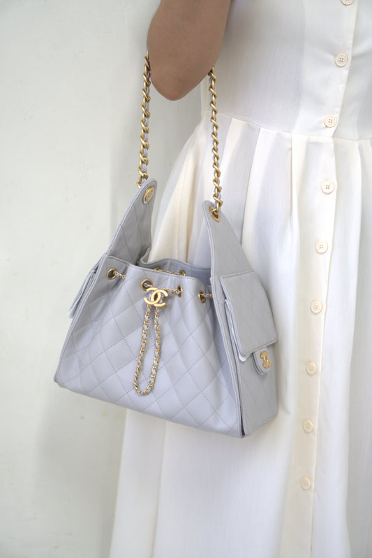 25C Small Drawstring Bag – Light Gray Caviar with Gold Hardware