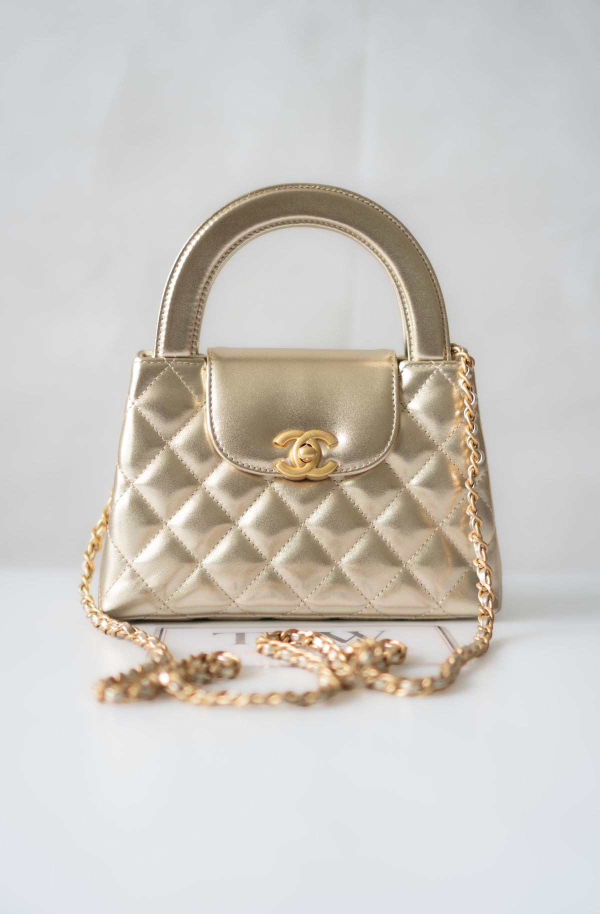 Kelly Top Handle Mini Flap – Metallic Gold Quilted Lambskin with Gold Hardware