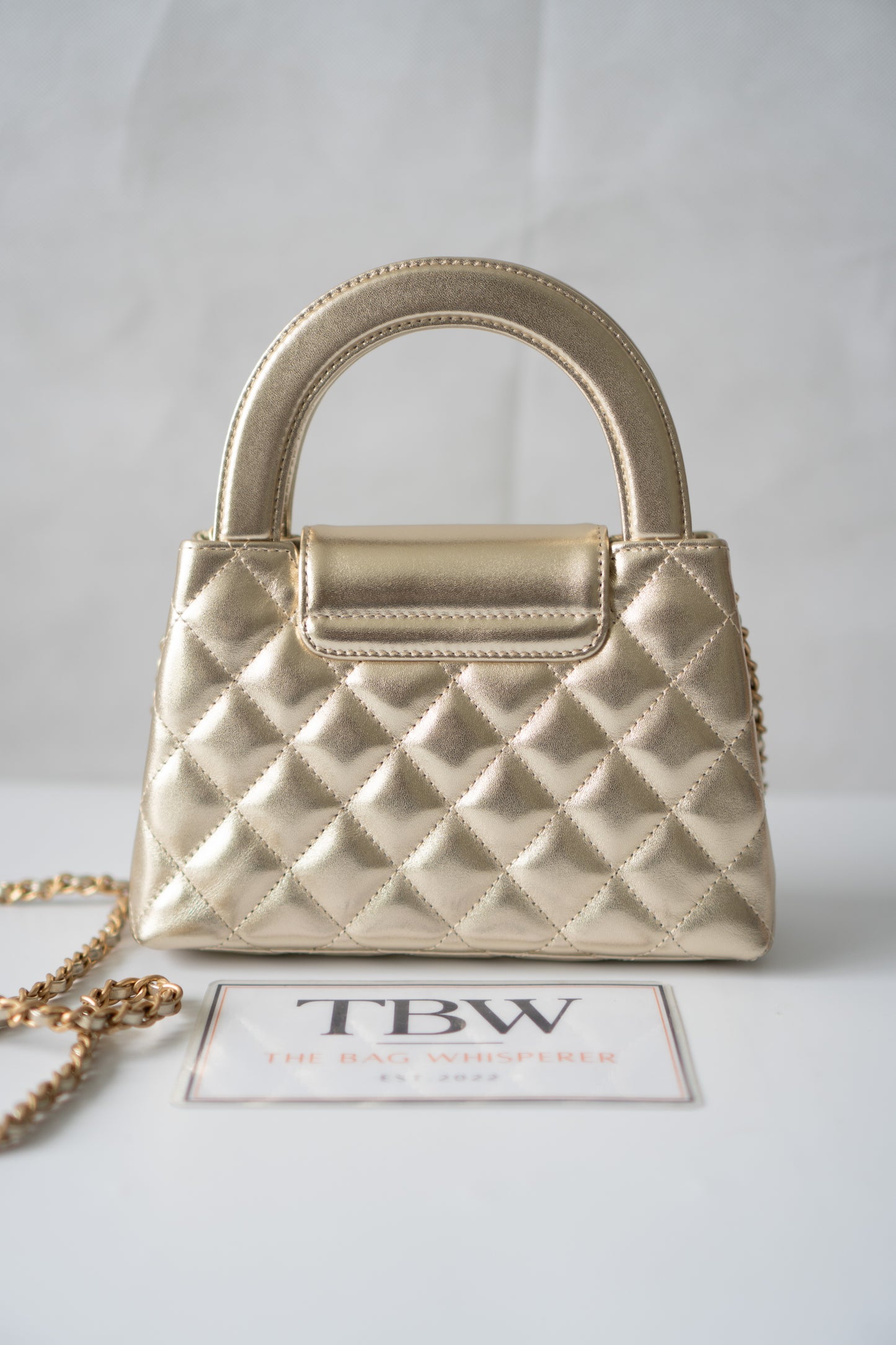 Kelly Top Handle Mini Flap – Metallic Gold Quilted Lambskin with Gold Hardware