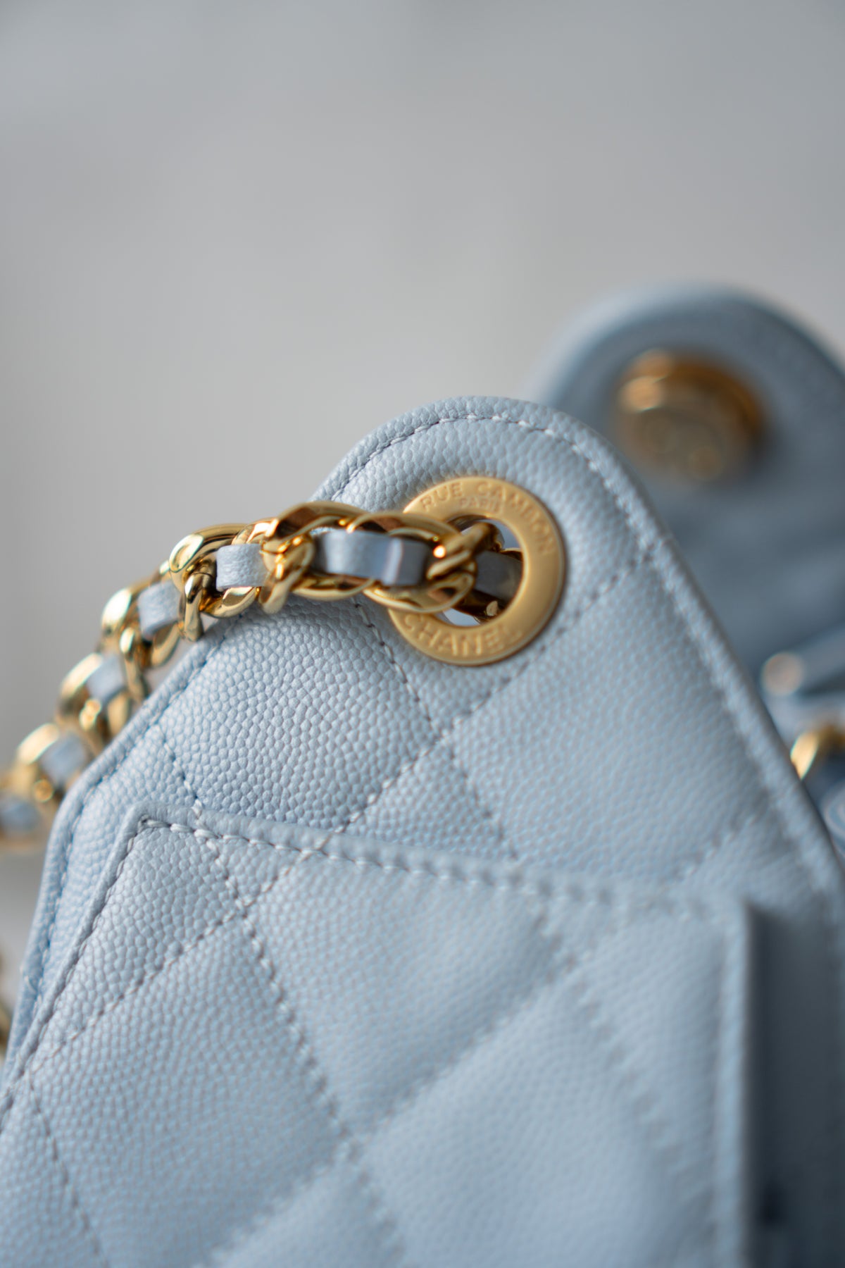 CC Drawstring Bucket Bag – Light Blue Quilted Caviar Leather with Gold Hardware