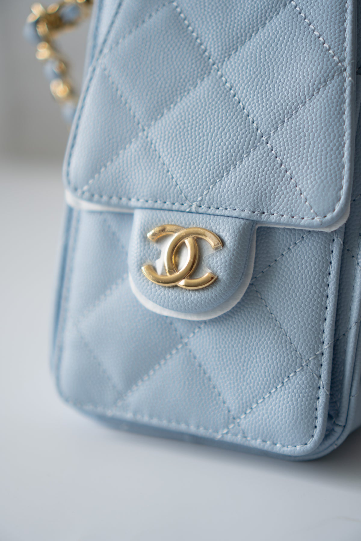 CC Drawstring Bucket Bag – Light Blue Quilted Caviar Leather with Gold Hardware