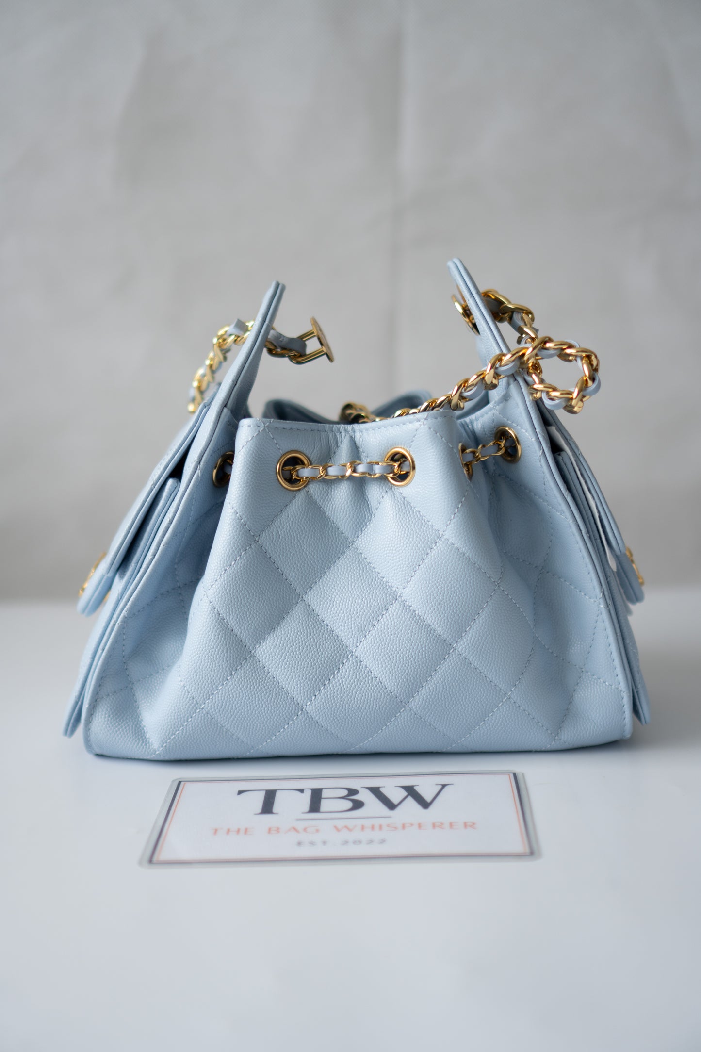 CC Drawstring Bucket Bag – Light Blue Quilted Caviar Leather with Gold Hardware