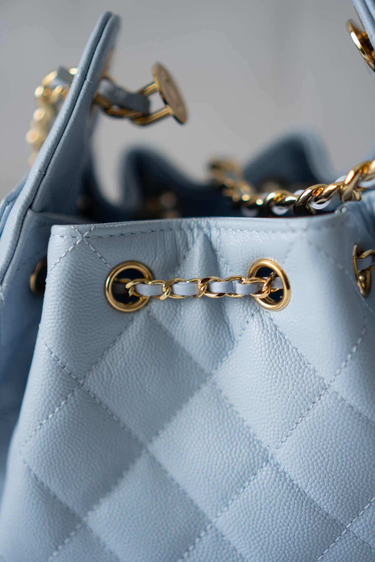 CC Drawstring Bucket Bag – Light Blue Quilted Caviar Leather with Gold Hardware