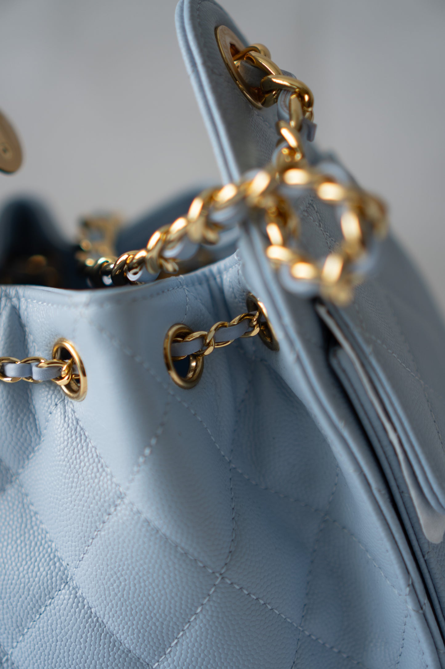 CC Drawstring Bucket Bag – Light Blue Quilted Caviar Leather with Gold Hardware