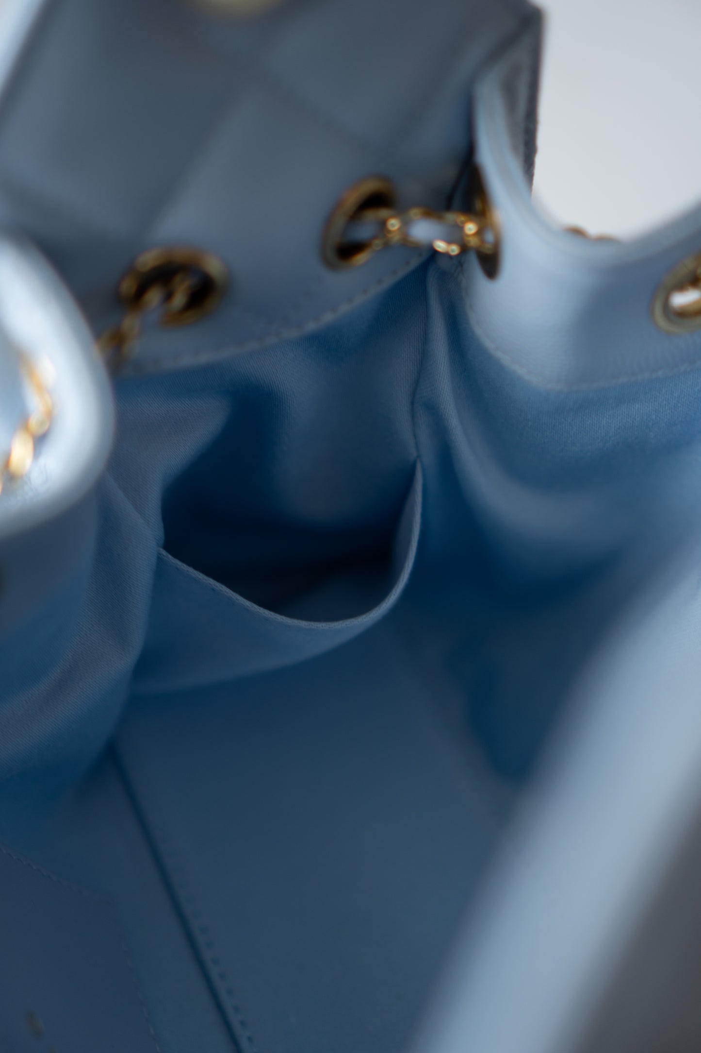 CC Drawstring Bucket Bag – Light Blue Quilted Caviar Leather with Gold Hardware