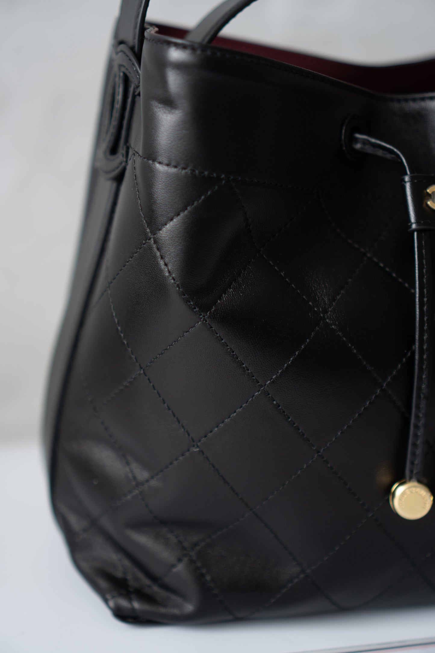 CC Small Bucket Bag – Black Quilted Lambskin with Gold Hardware