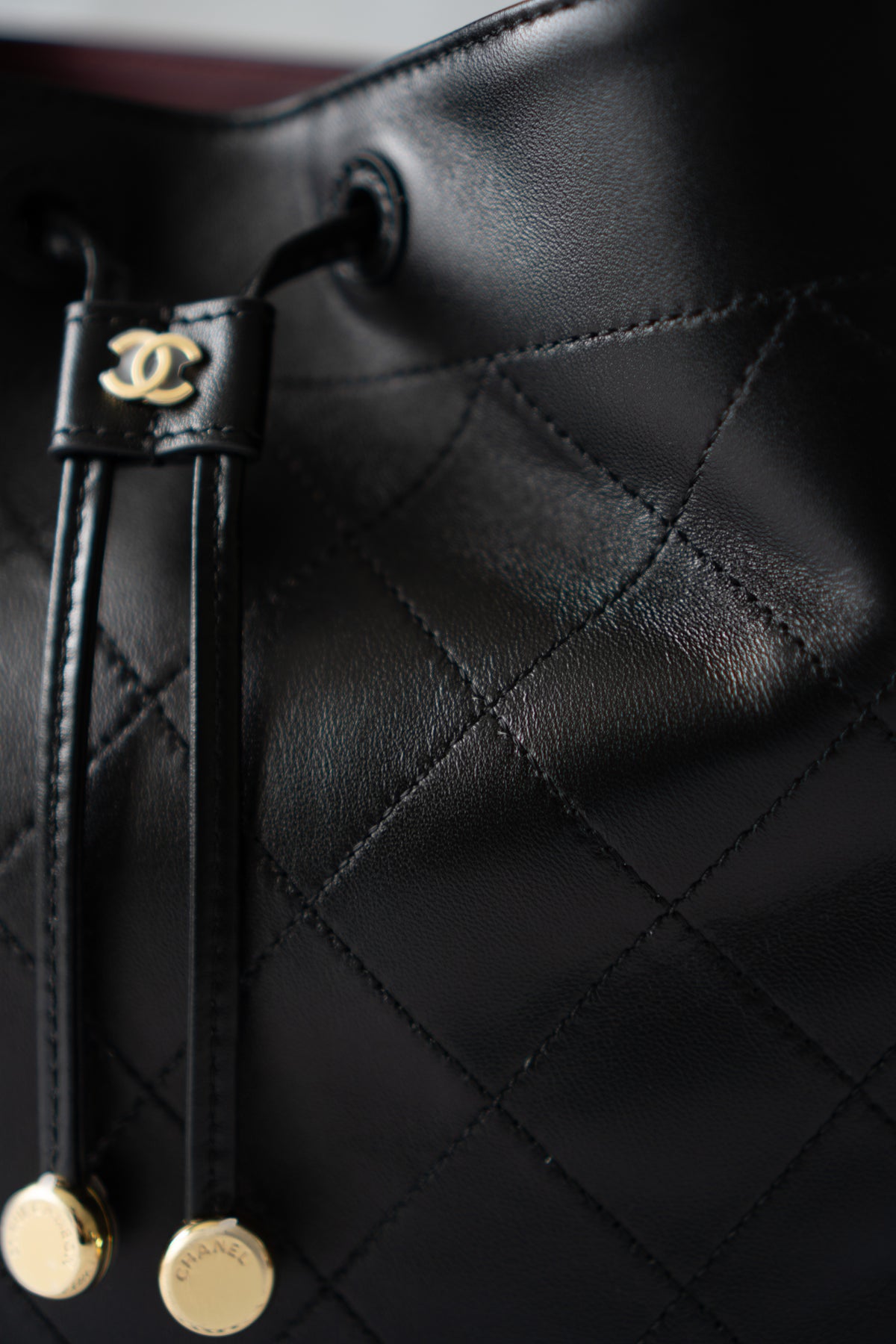 CC Small Bucket Bag – Black Quilted Lambskin with Gold Hardware