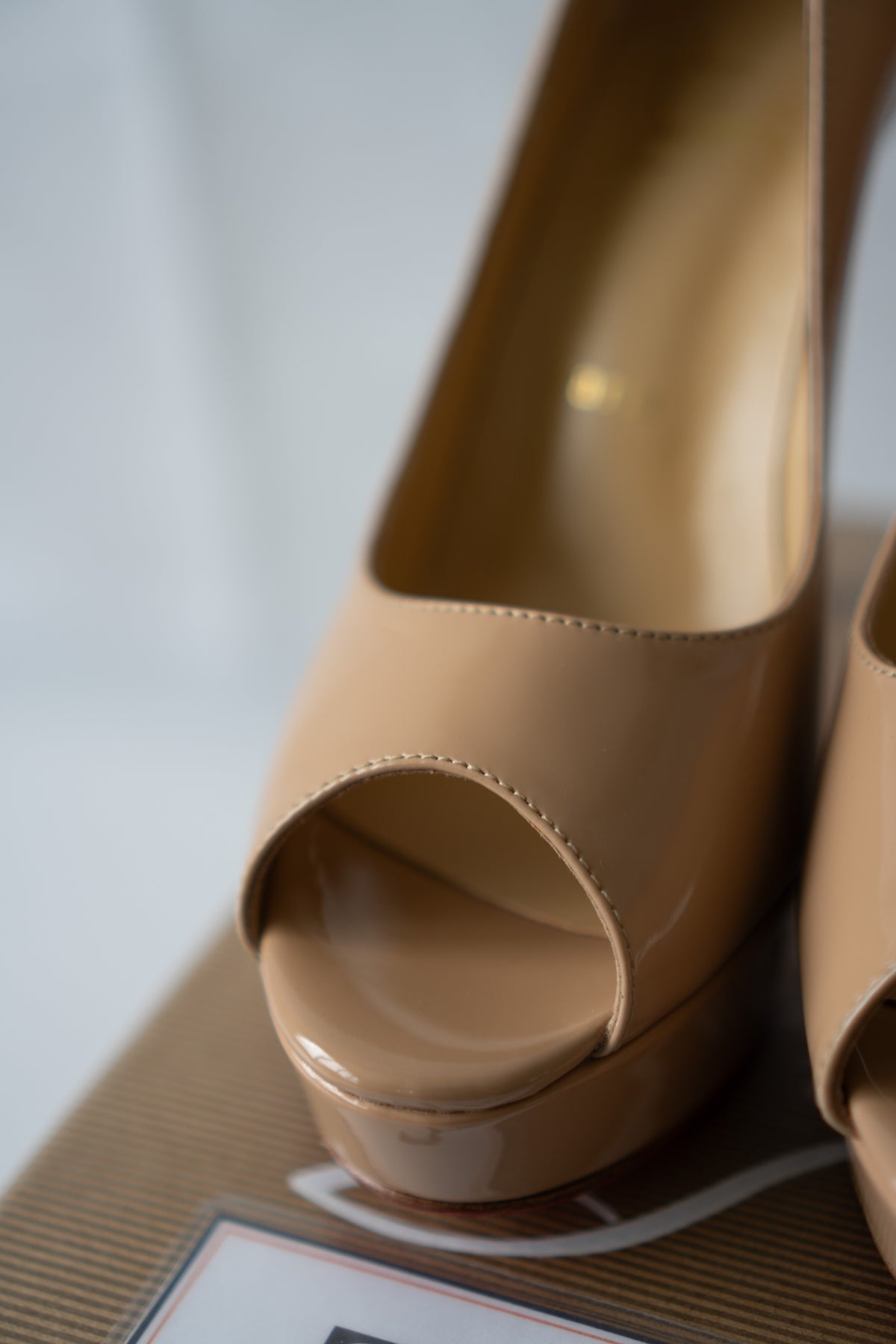 Peep-Toe Platform Pumps – Nude Patent Leather with Signature Red Soles