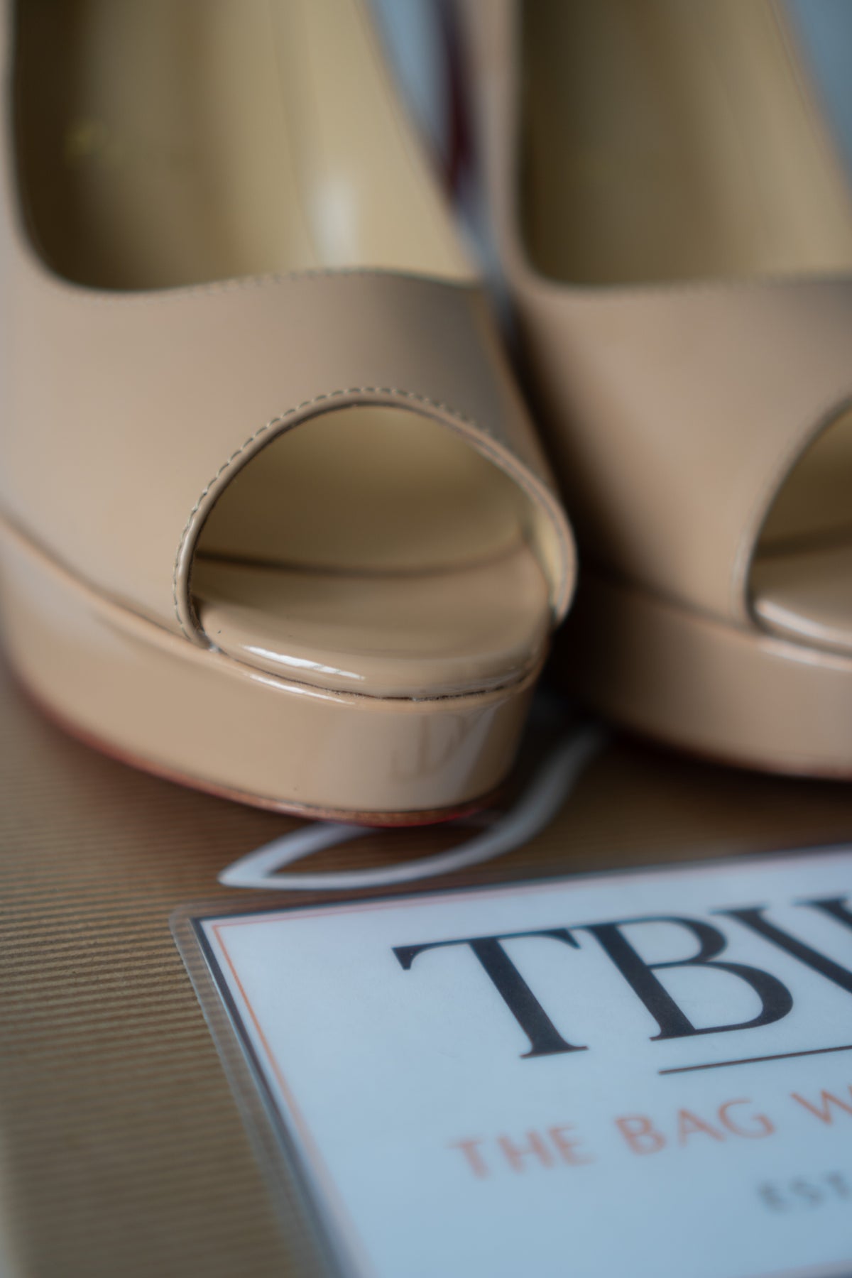 Peep-Toe Platform Pumps – Nude Patent Leather with Signature Red Soles