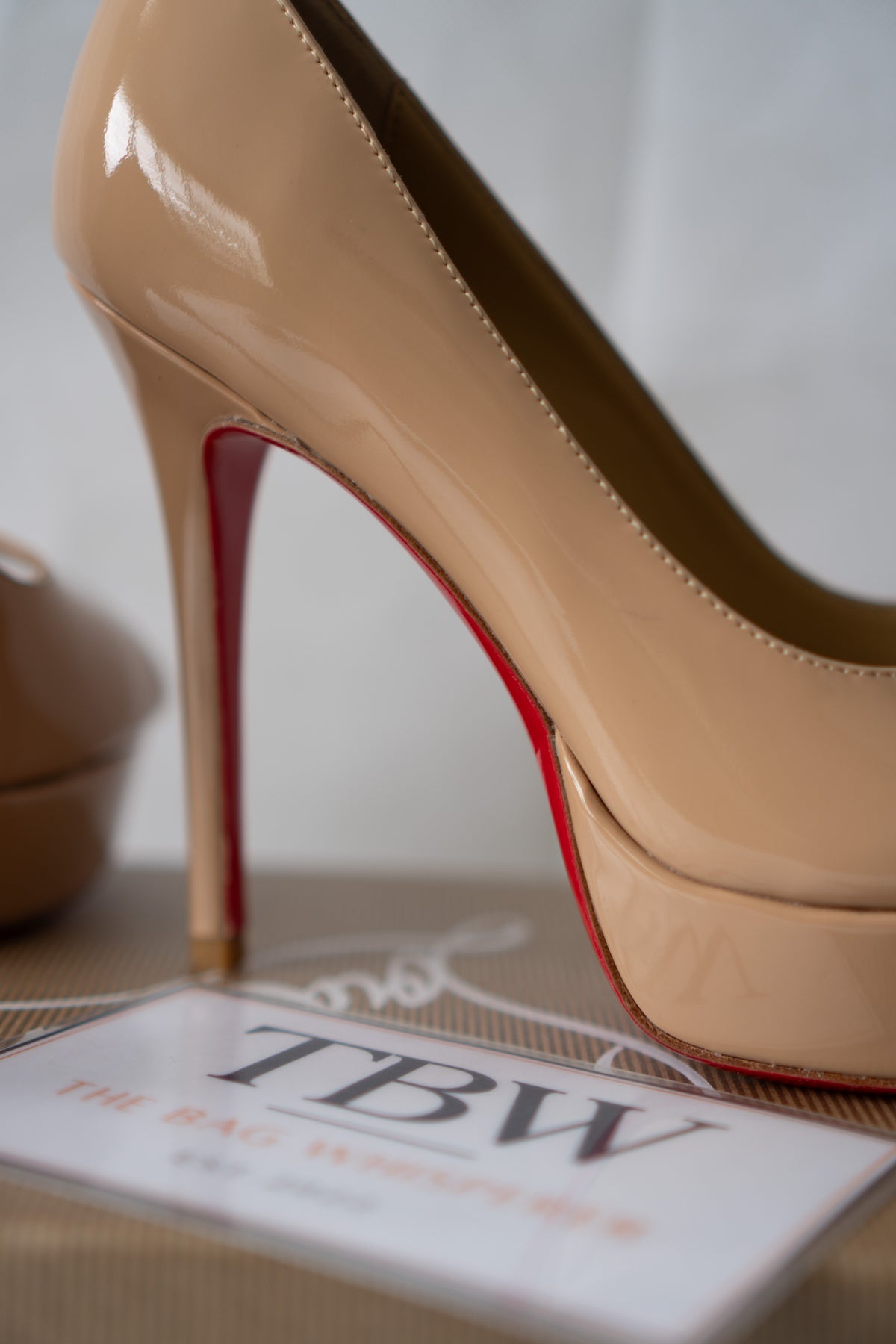 Peep-Toe Platform Pumps – Nude Patent Leather with Signature Red Soles