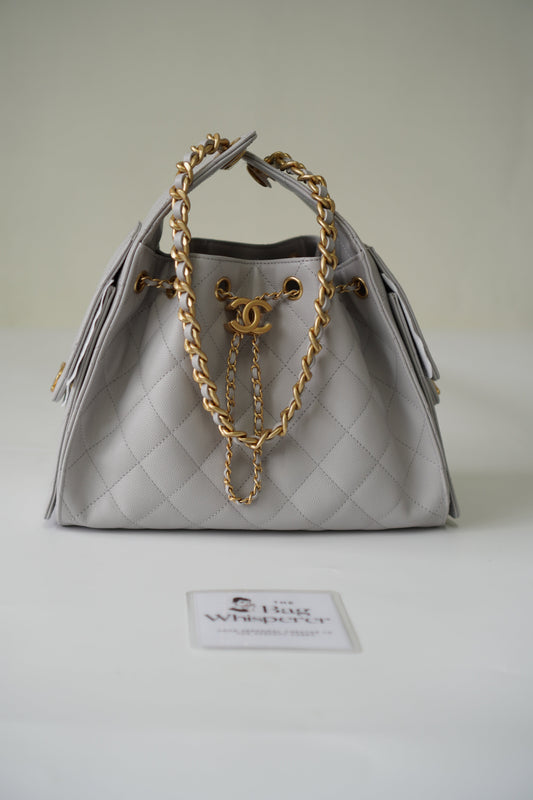 25C Small Drawstring Bag – Light Gray Caviar with Gold Hardware