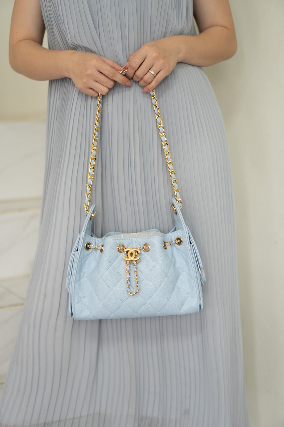 CC Drawstring Bucket Bag – Light Blue Quilted Caviar Leather with Gold Hardware
