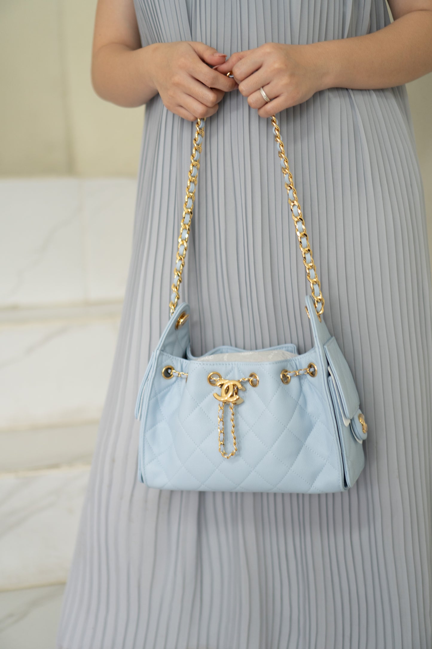 CC Drawstring Bucket Bag – Light Blue Quilted Caviar Leather with Gold Hardware