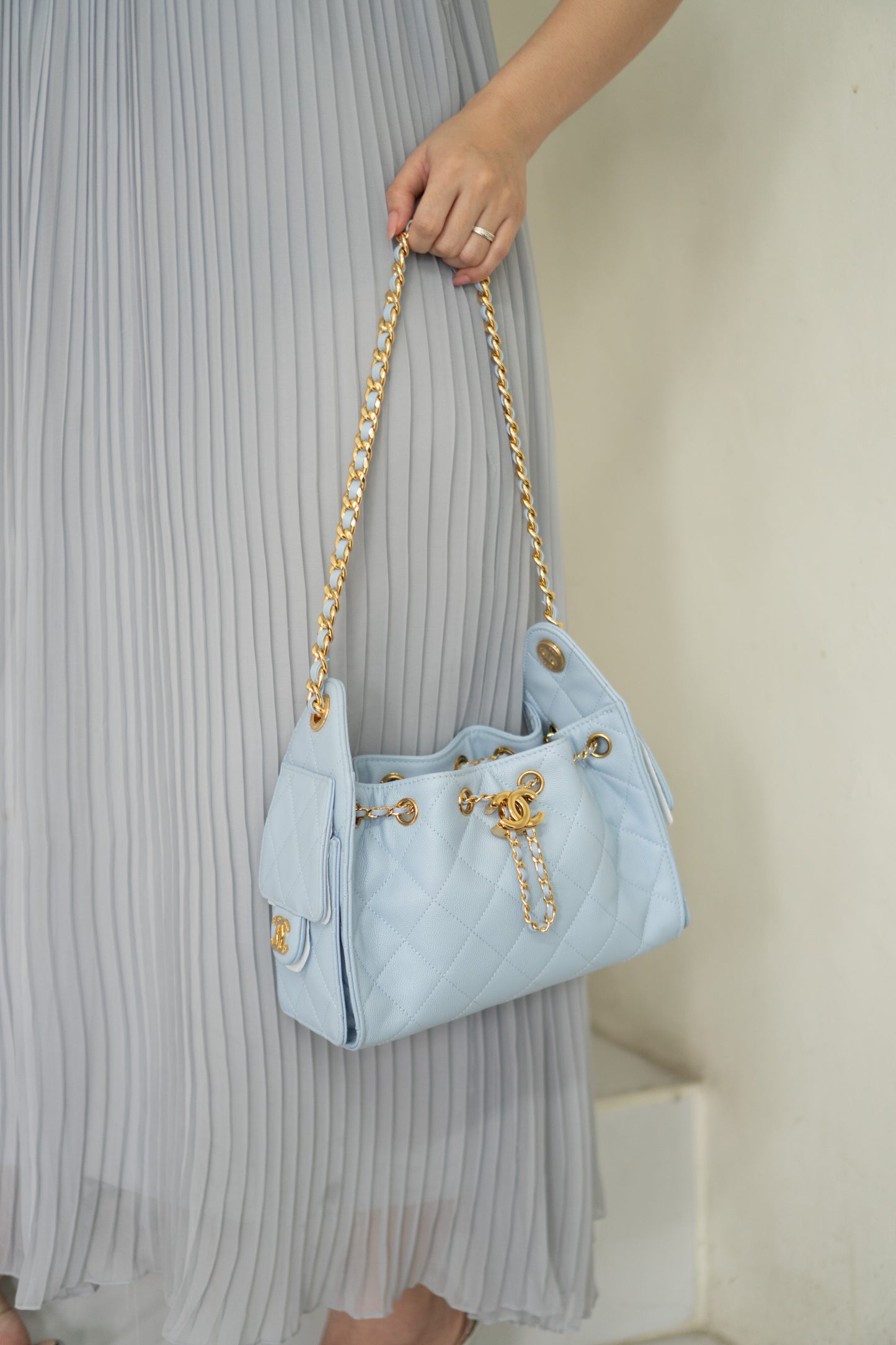CC Drawstring Bucket Bag – Light Blue Quilted Caviar Leather with Gold Hardware