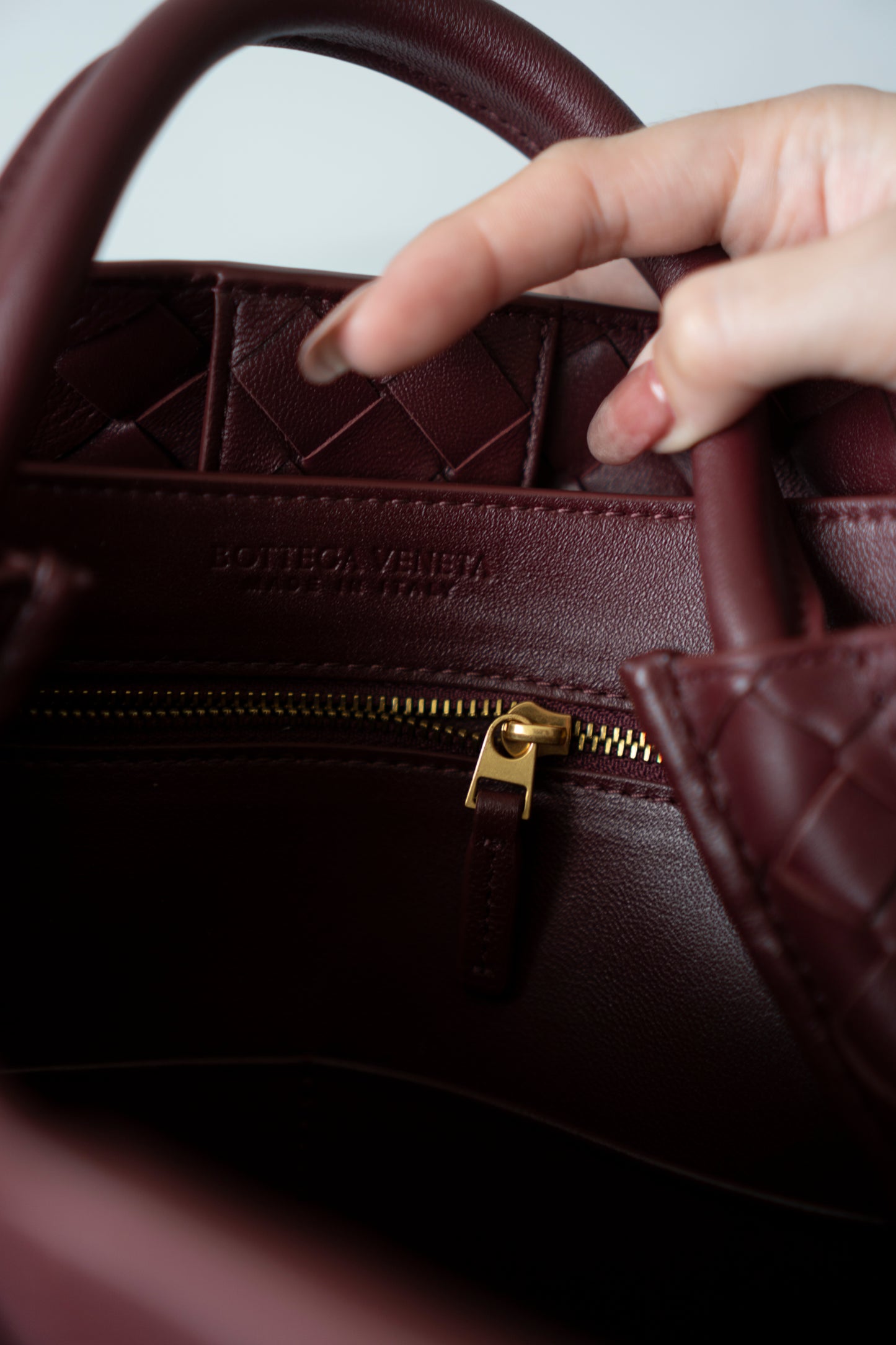 Andiamo Medium – Burgundy Intrecciato Nappa with Gold Hardware