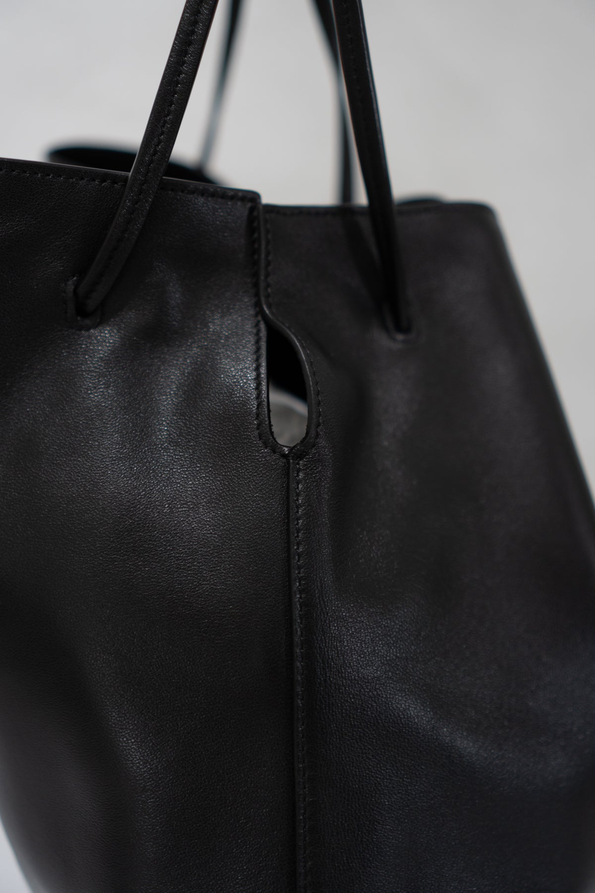 Monogram Drawstring Bucket Bag – Black Lambskin Leather with Gold Hardware