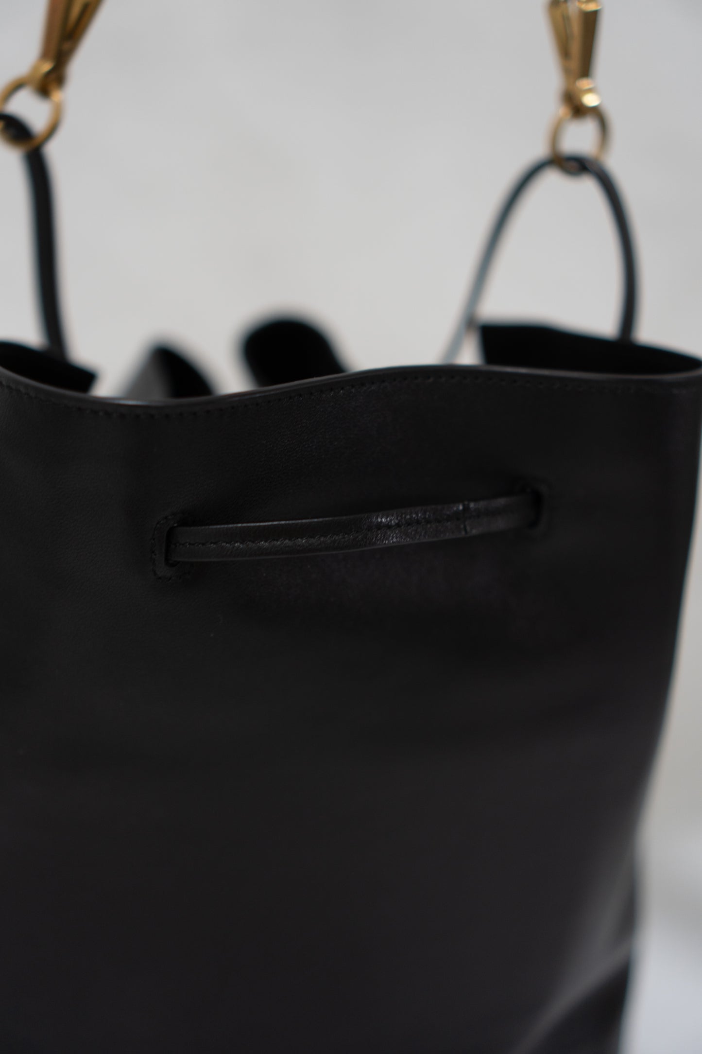Monogram Drawstring Bucket Bag – Black Lambskin Leather with Gold Hardware