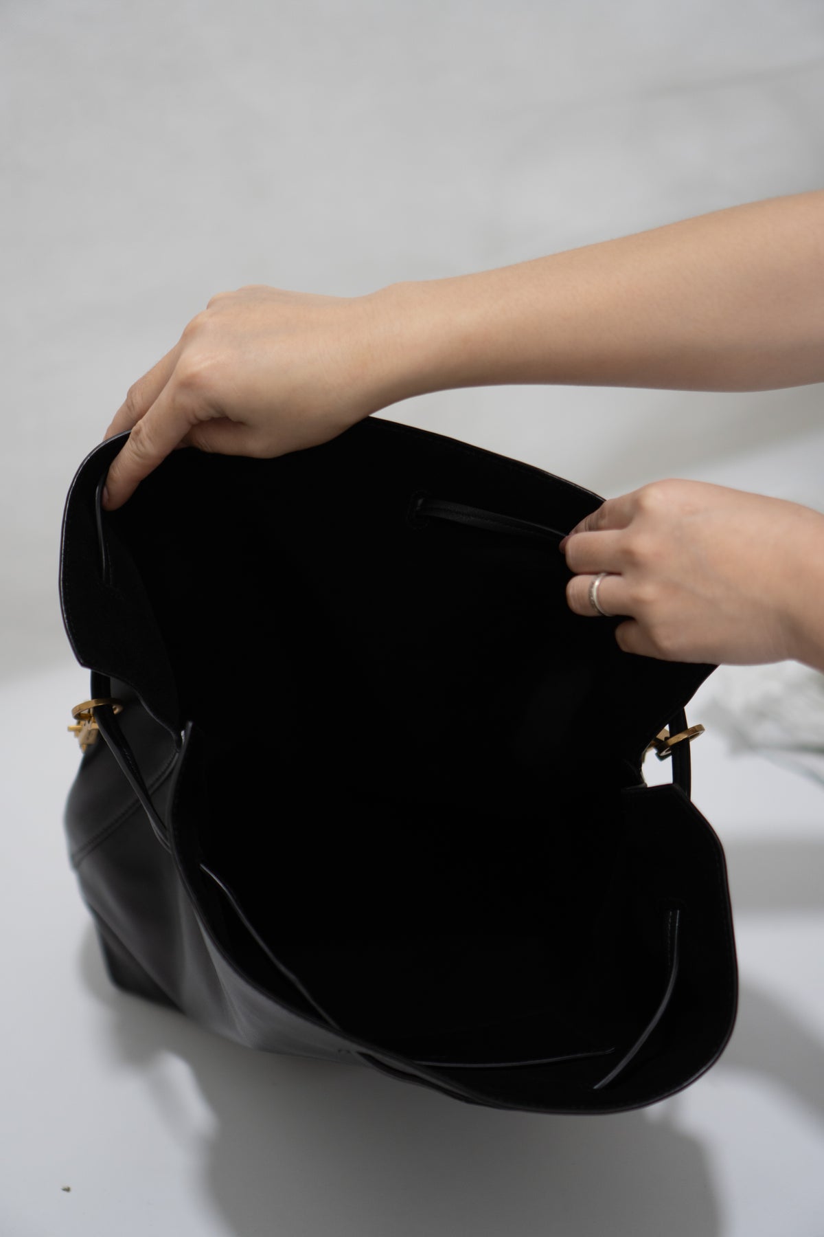 Monogram Drawstring Bucket Bag – Black Lambskin Leather with Gold Hardware
