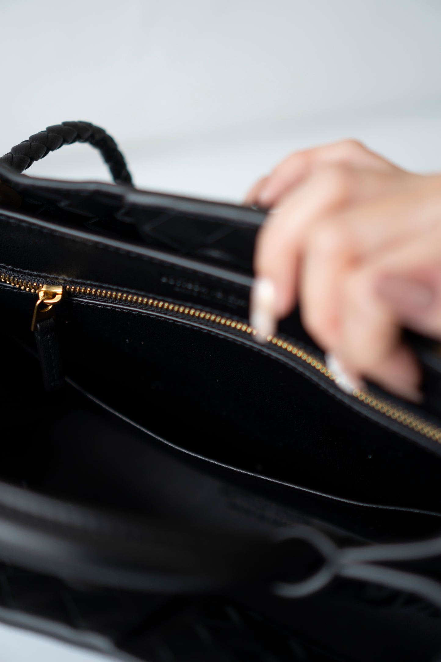 Andiamo Small – Black Intrecciato Nappa with Gold Hardware