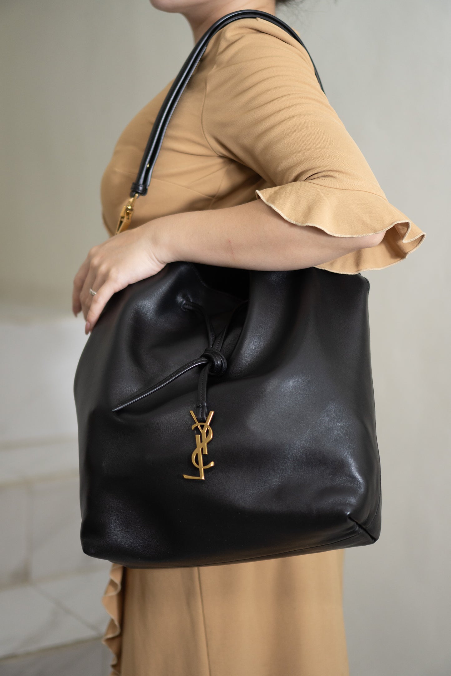 Monogram Drawstring Bucket Bag – Black Lambskin Leather with Gold Hardware