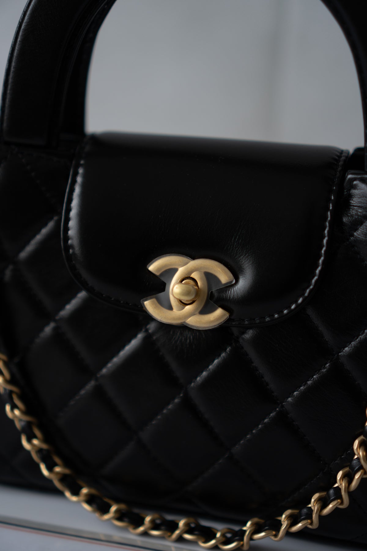 Mini Kelly Top Handle Bag – Black Lambskin