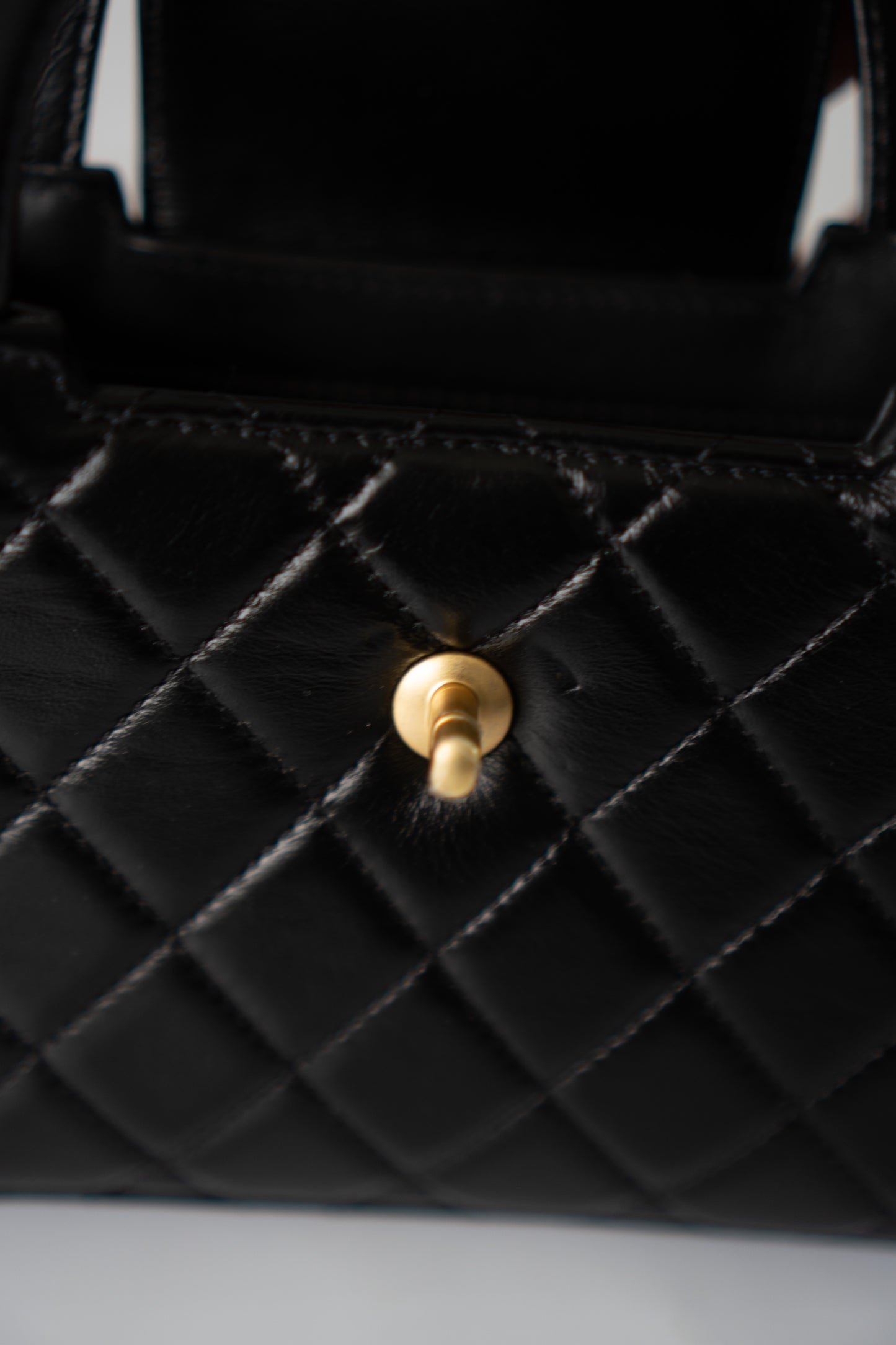 Mini Kelly Top Handle Bag – Black Lambskin
