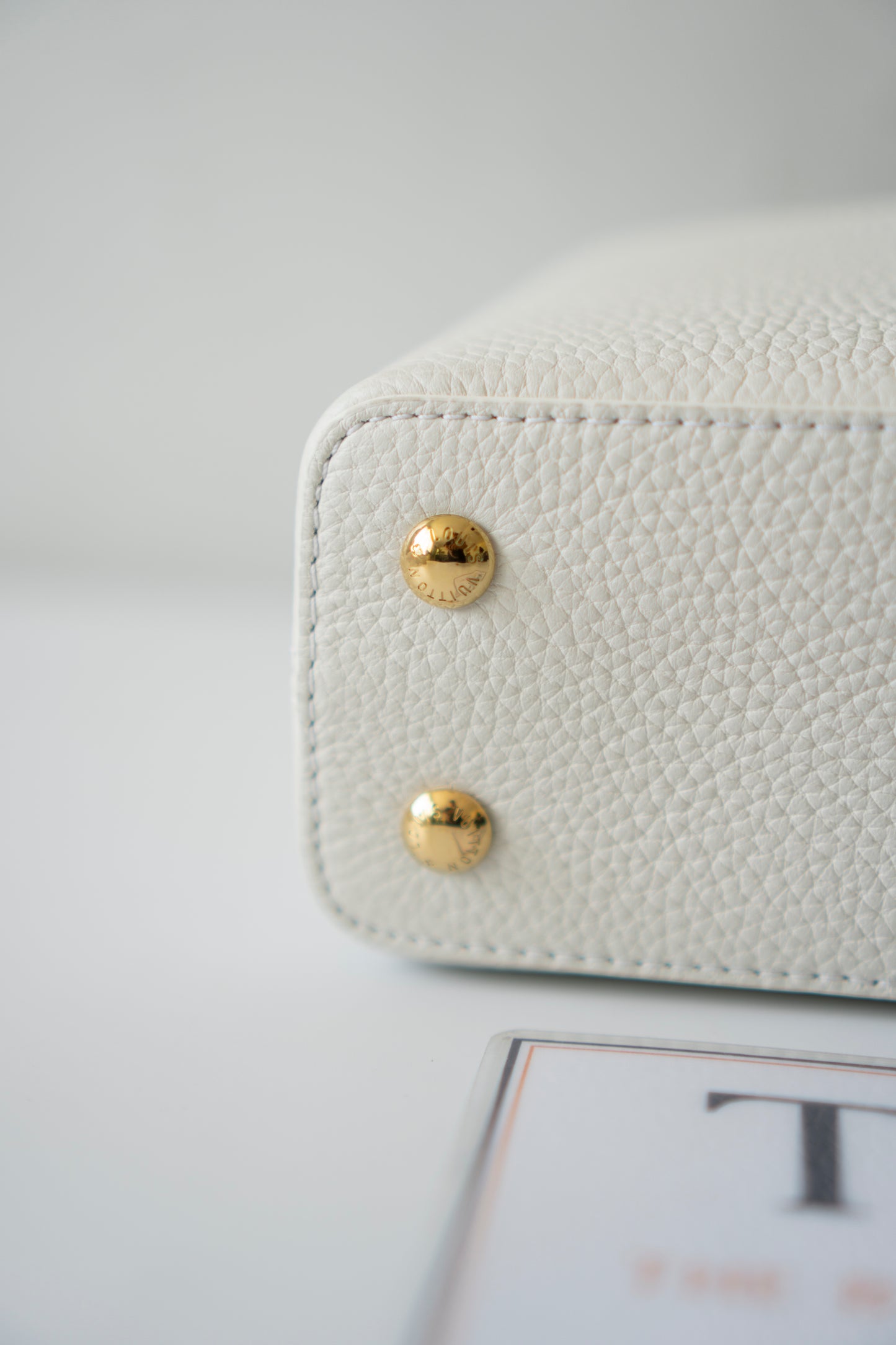 Capucines Mini – White Taurillon with Snakeskin Handle