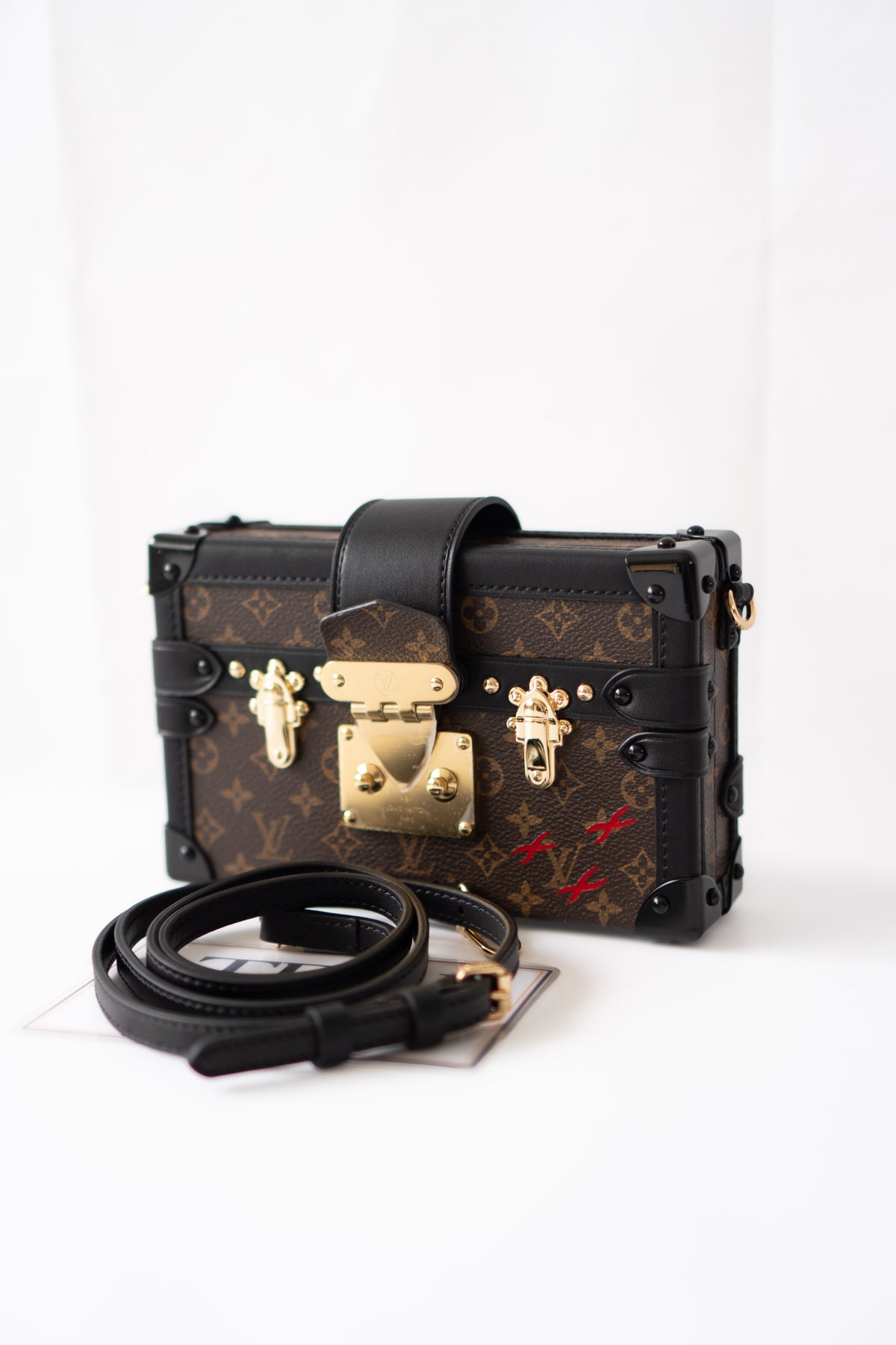 Petite Malle – Monogram Canvas with Black Calfskin & Gold-Tone Hardware