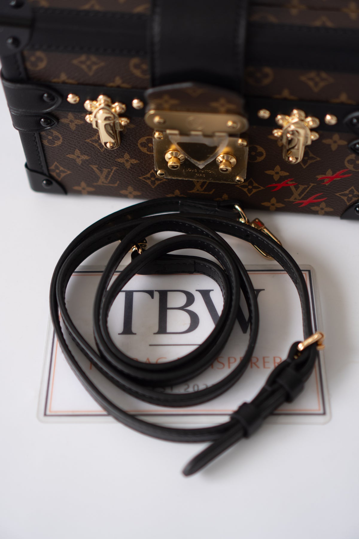 Petite Malle – Monogram Canvas with Black Calfskin & Gold-Tone Hardware