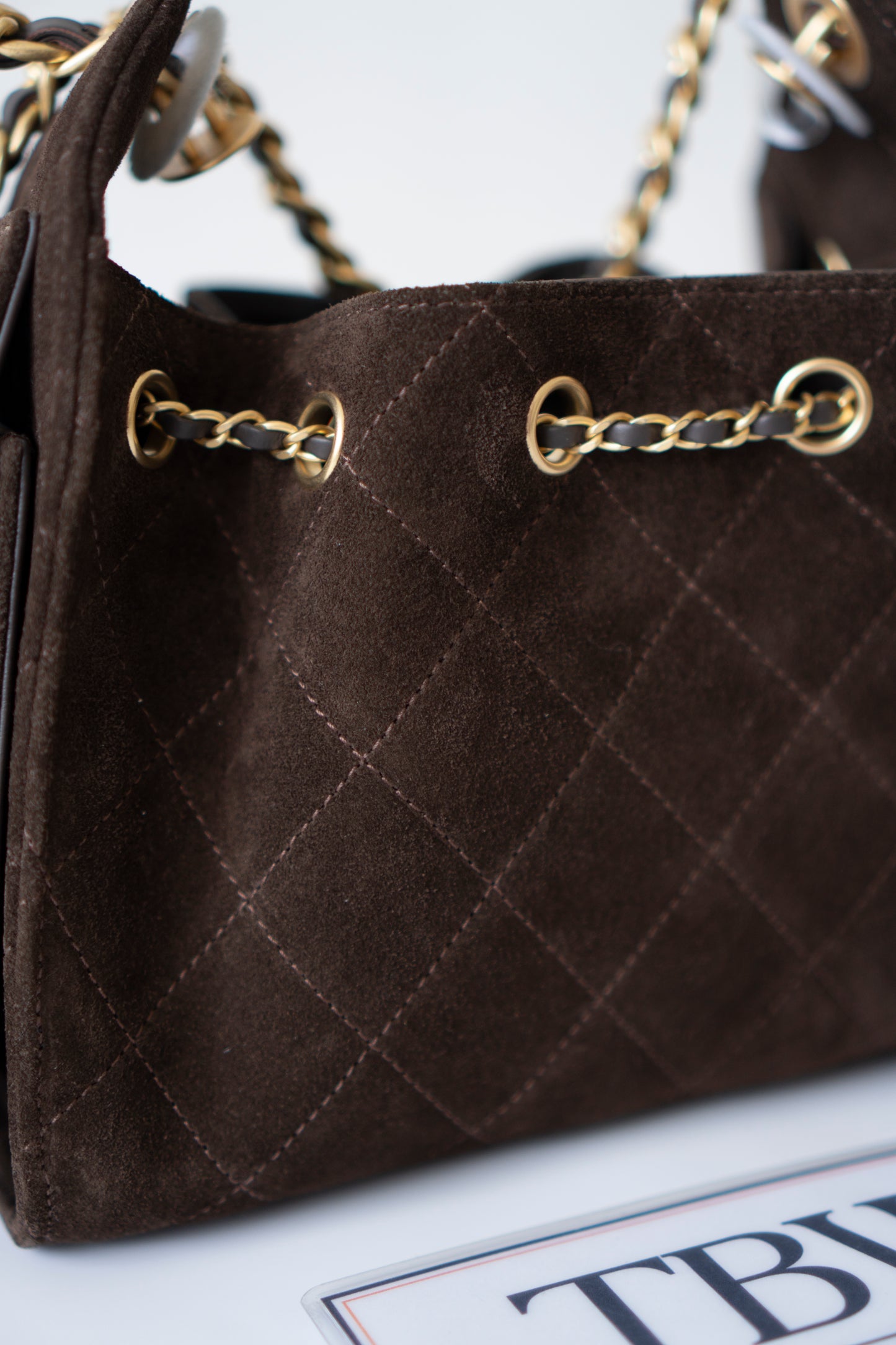 C25 Mini Drawstring Chain Bag – Dark Brown Suede with Gold Hardware