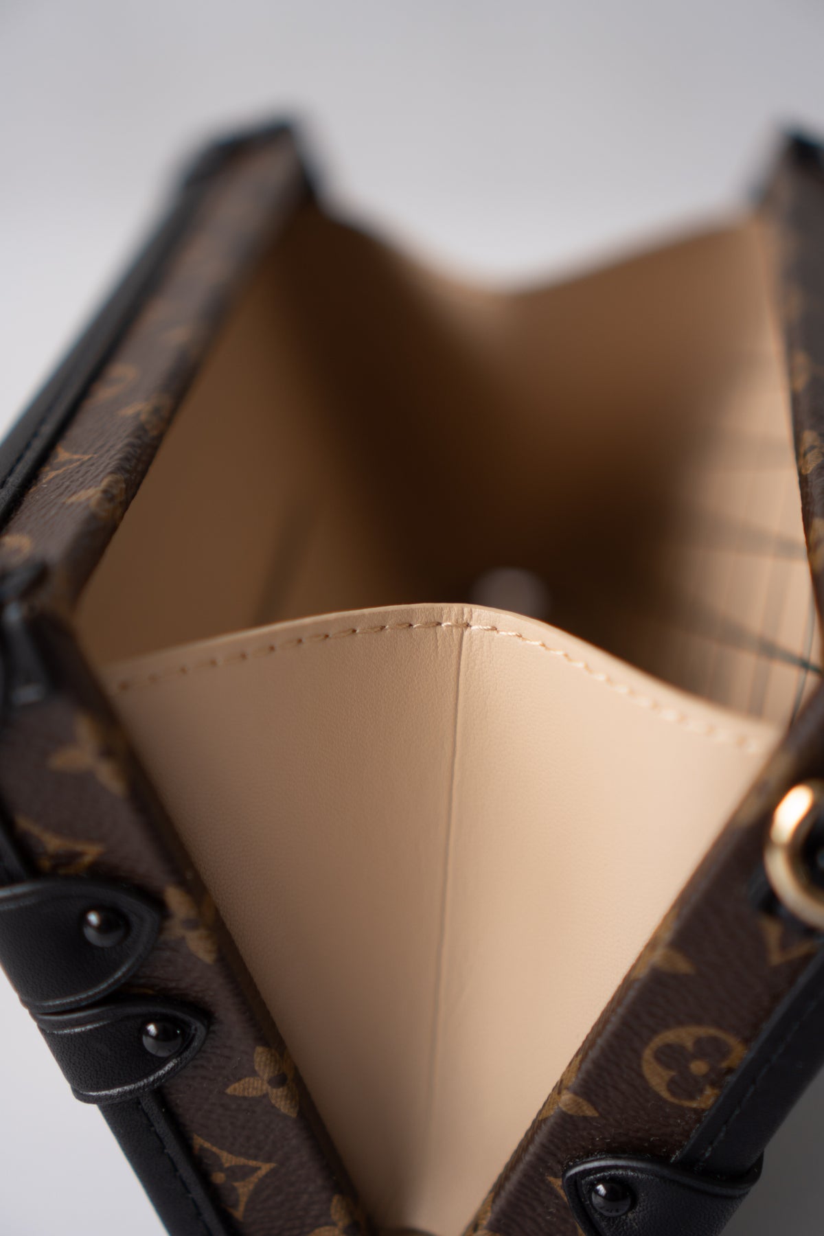 Petite Malle – Monogram Canvas with Black Calfskin & Gold-Tone Hardware